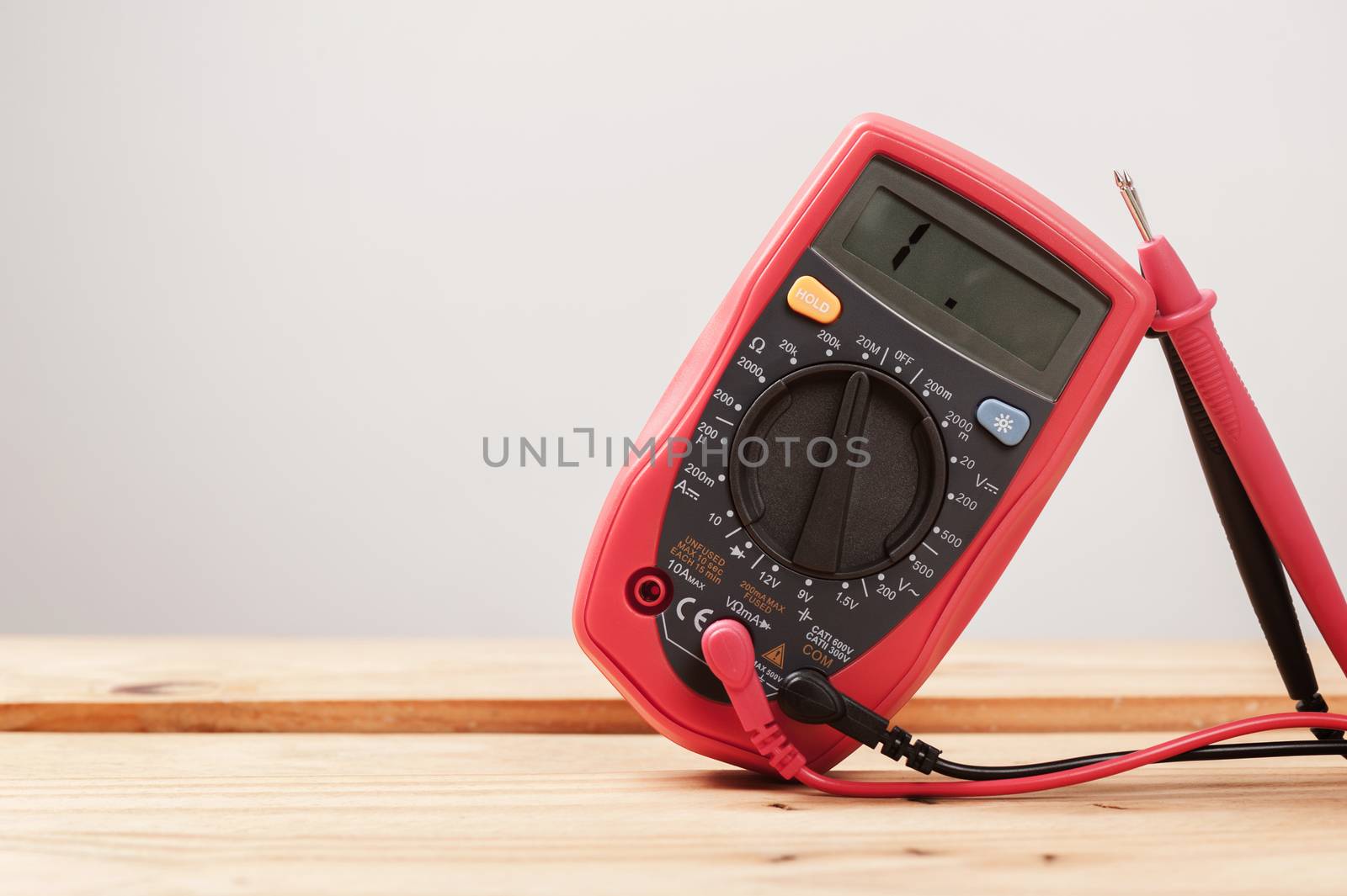 red digital multimeter by norgal