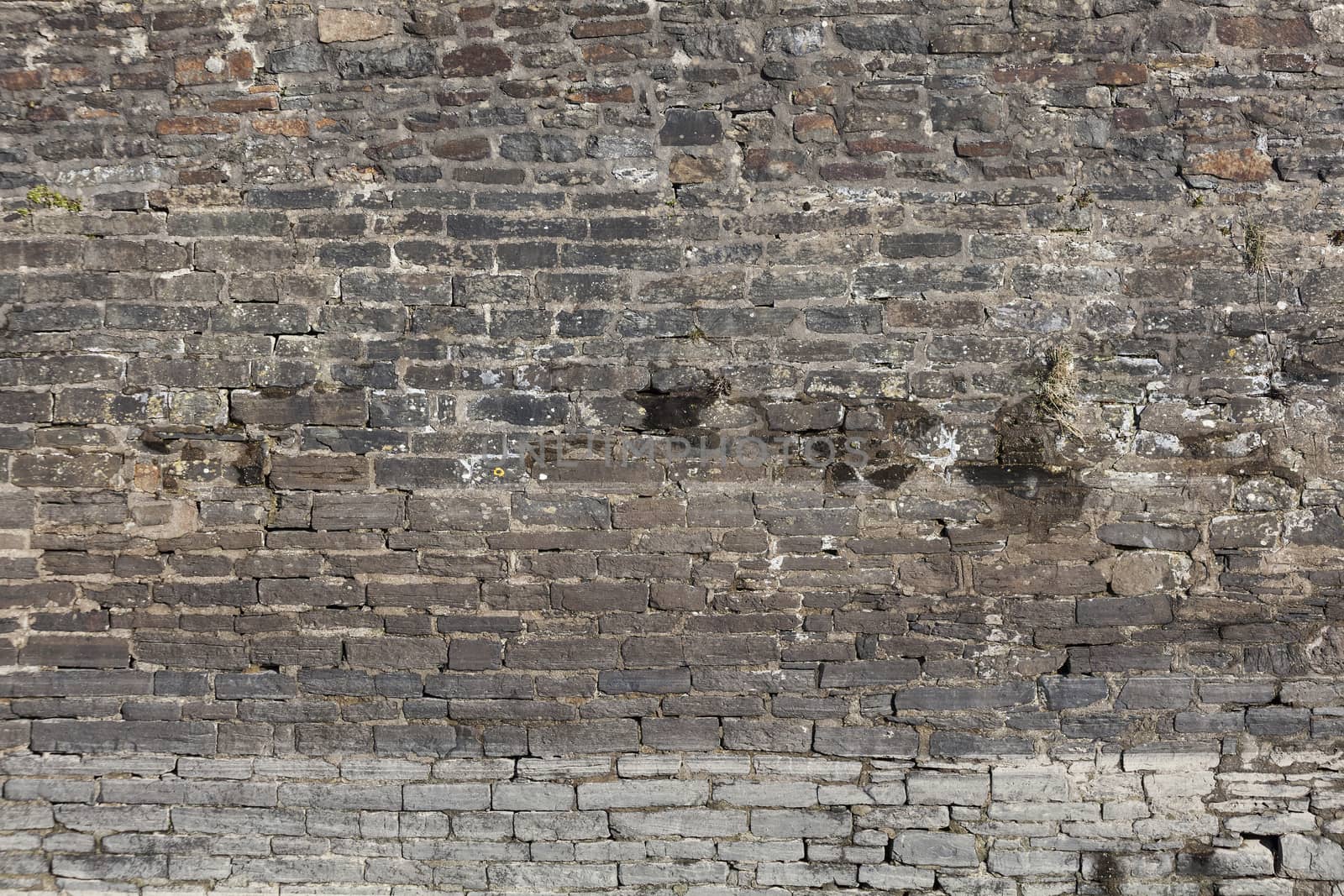 Old large weathered distressed red brick wall texture background