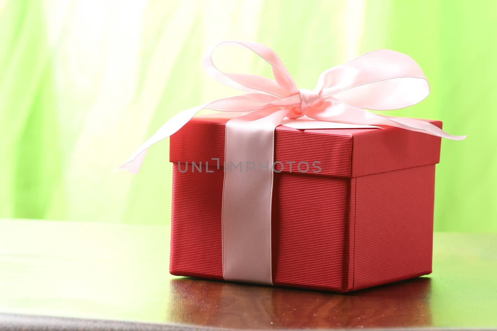 Presents on a table with a bow. Background space for copy by PeterHofstetter