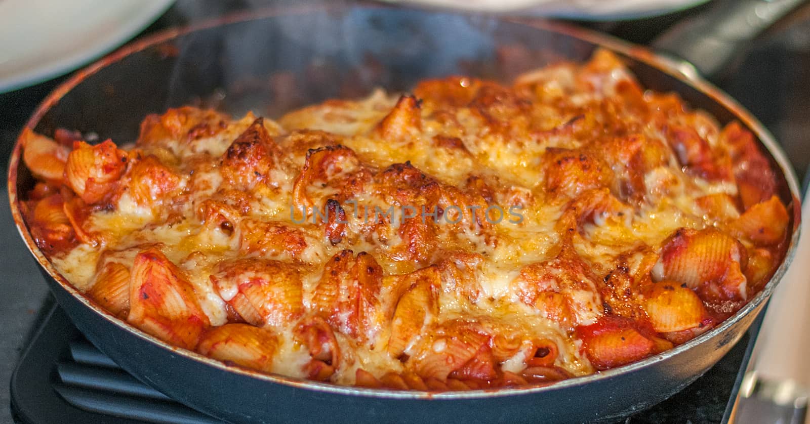 pasta cheese and passata in a pan