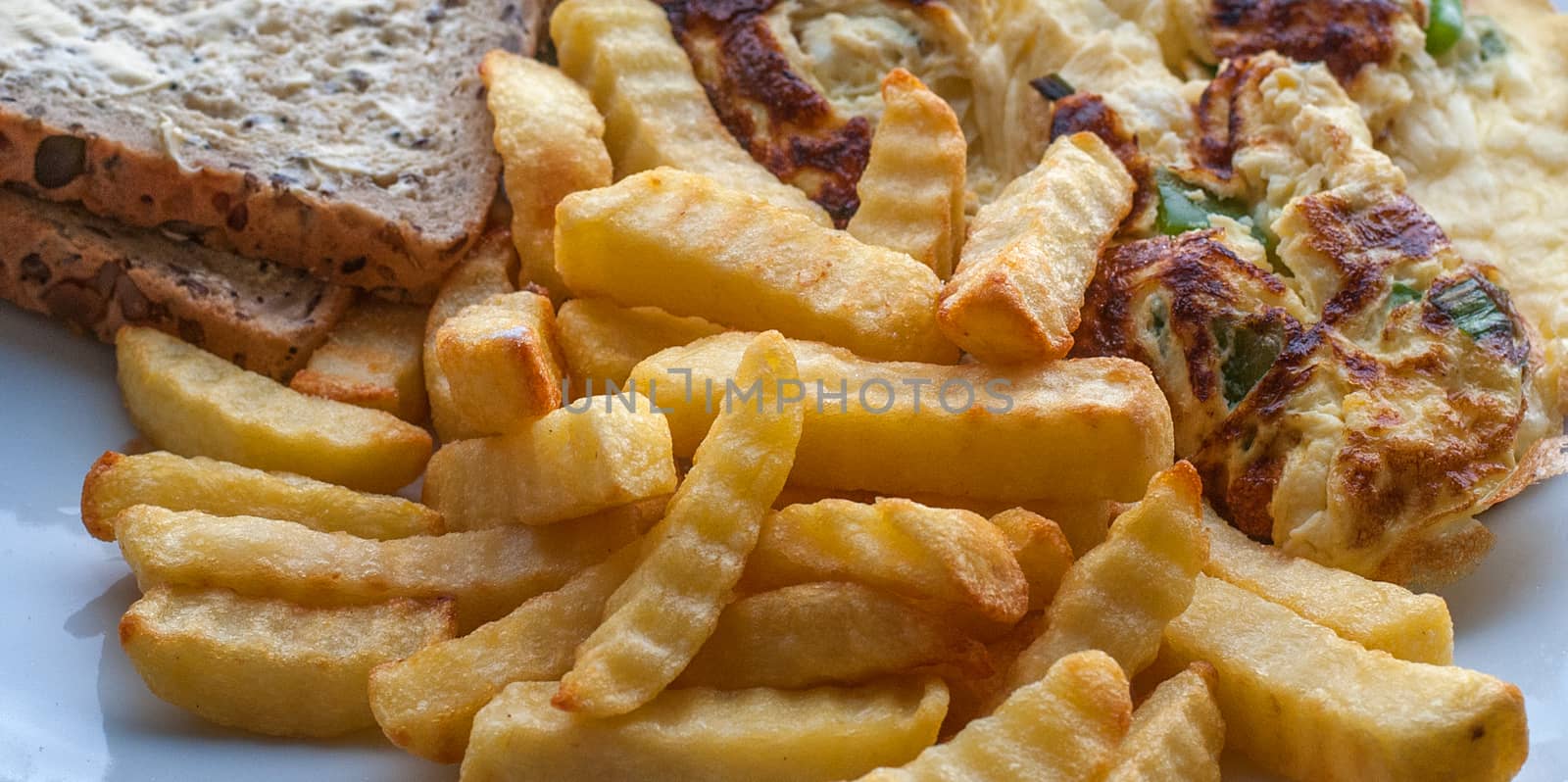 chips on a plate with omelette and brown bread by sirspread