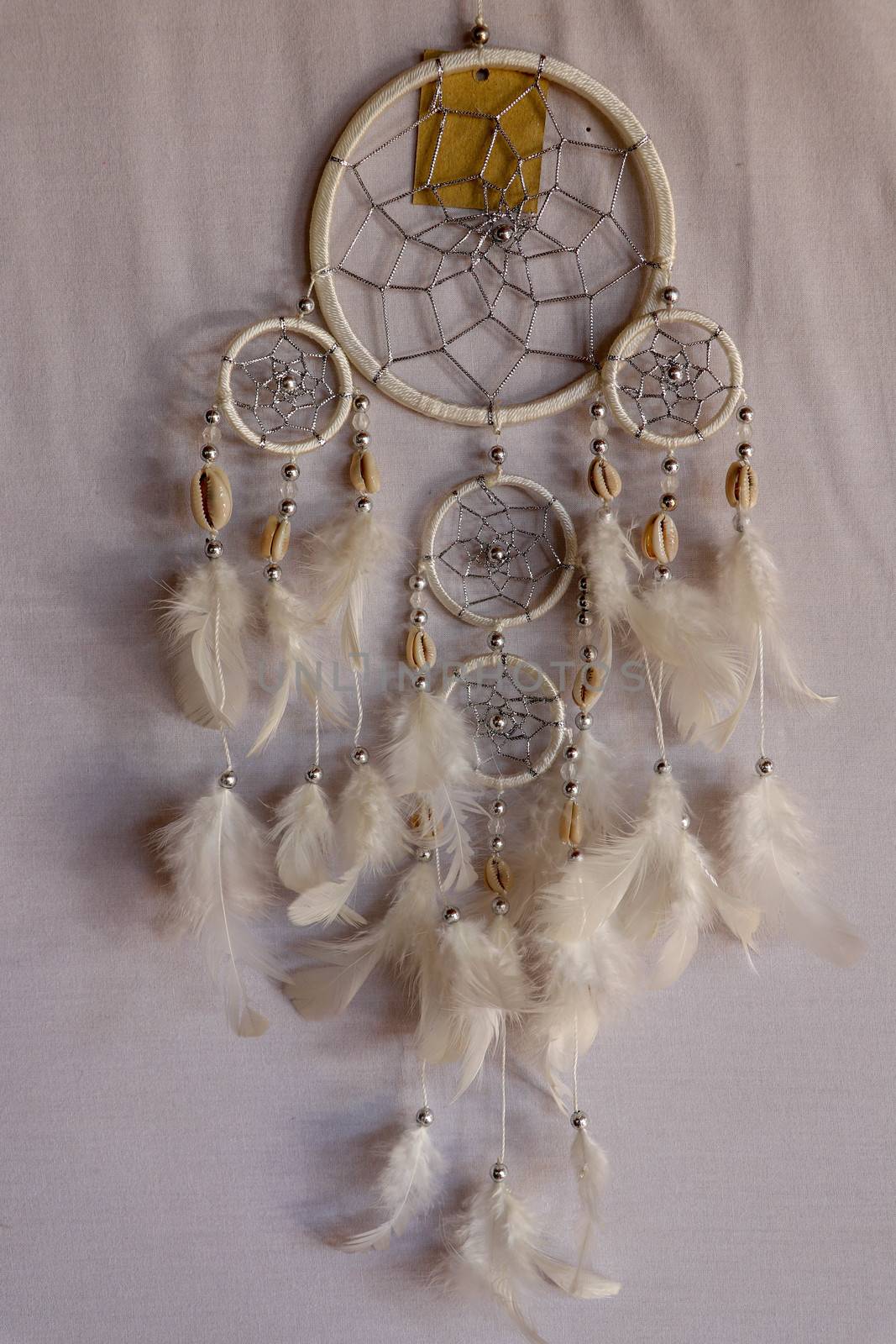 White color dream catcher with white feathers in the interior. Home Decor Concept..