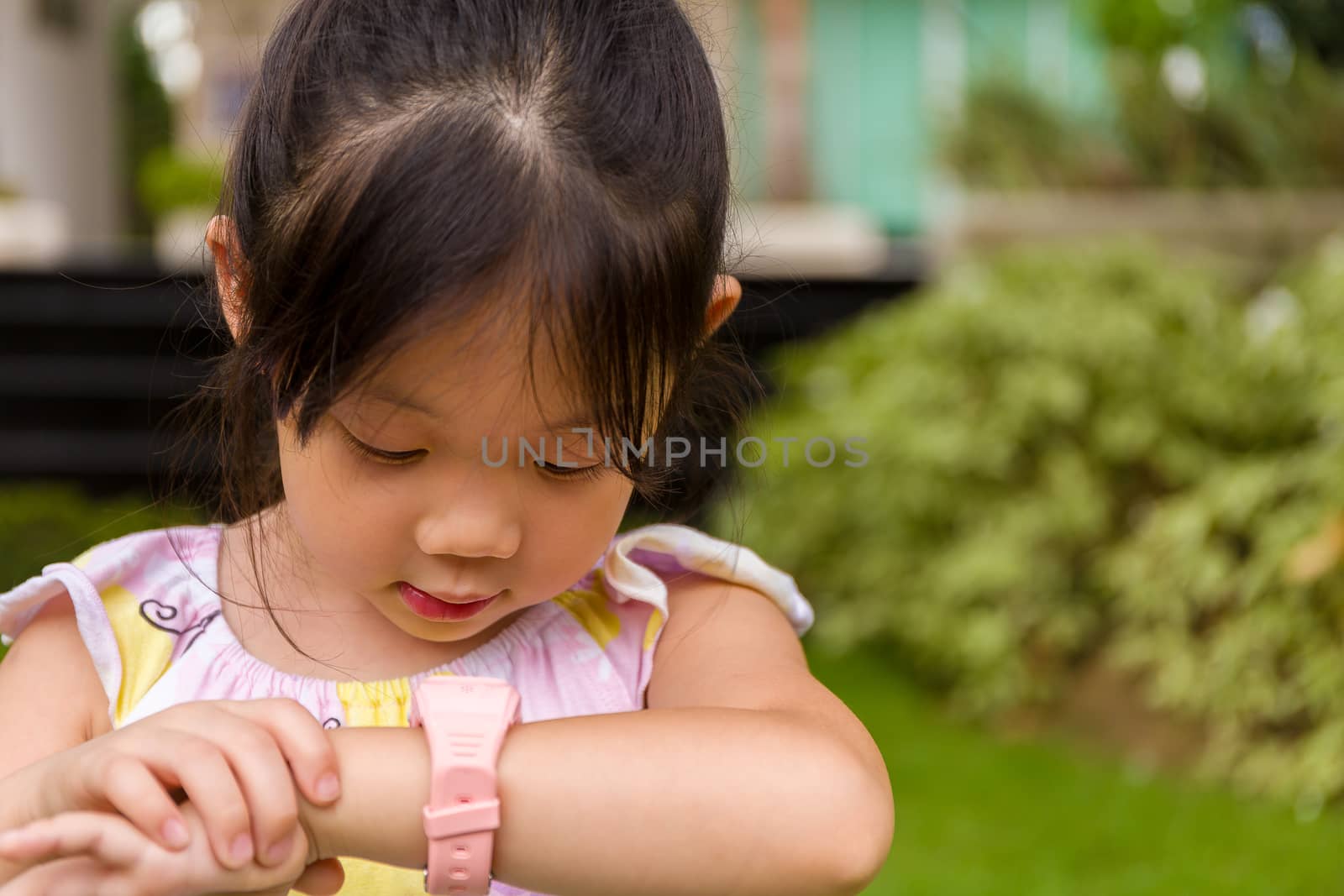 Child Using Smartwatch or Smart Watch / Child with Smartwatch or by supparsorn