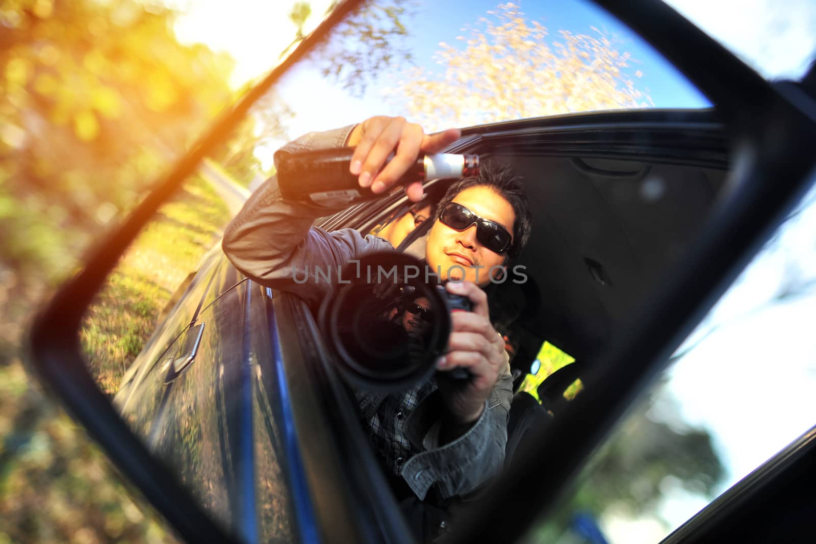 Close up of a handsome man siting in his car in Travel Trip