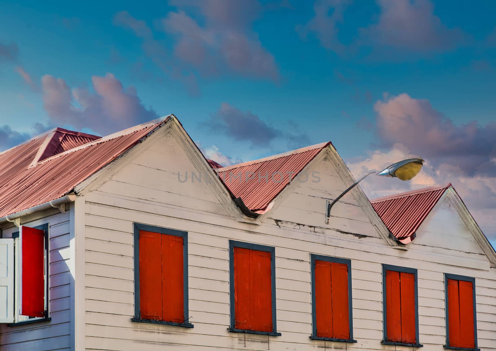 Red Shutters and Roof at Dusk by dbvirago