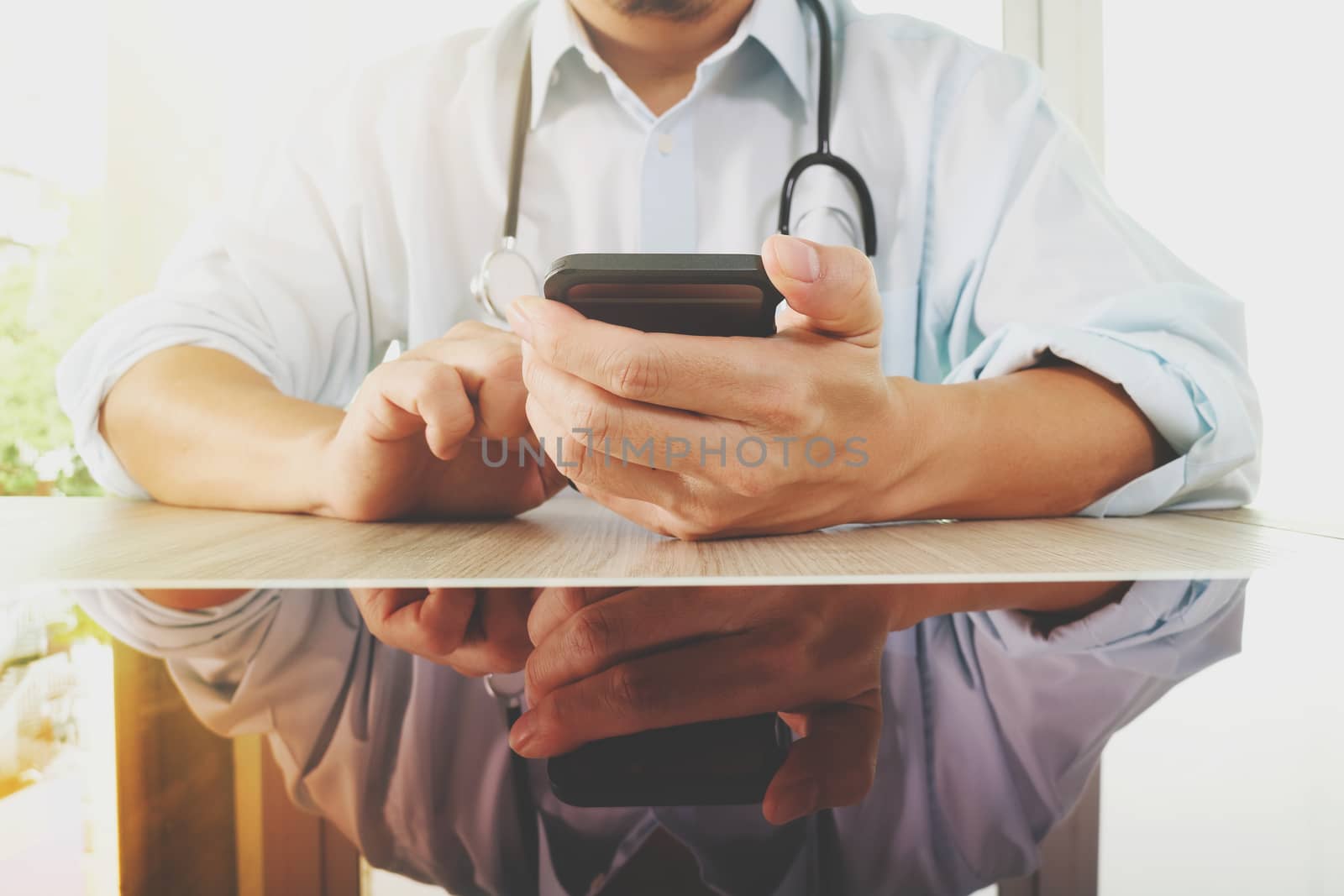 Medicine doctor hand working with modern smart phone as medical  by everythingpossible