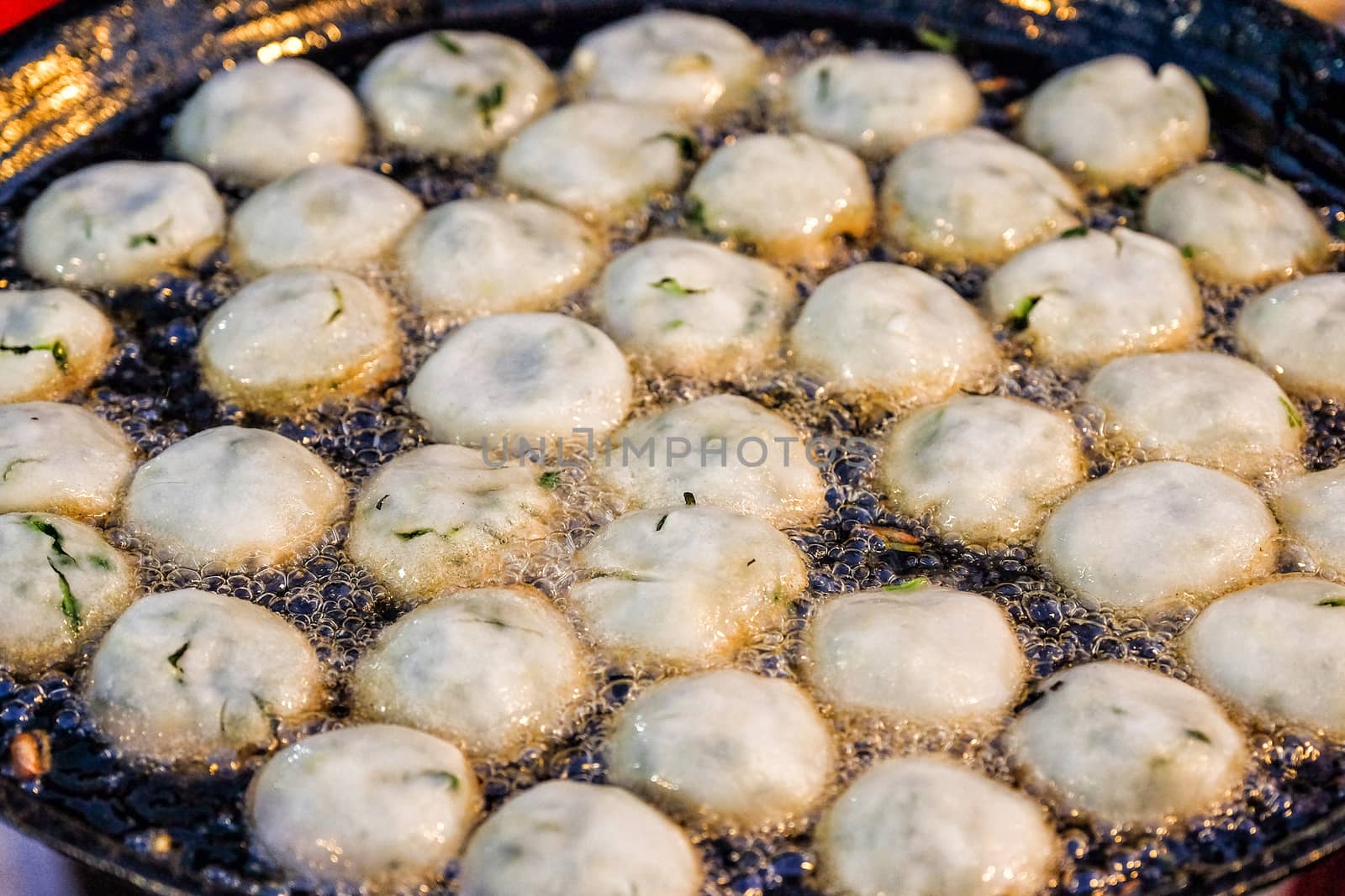 Garlic chives on hot plate in nigth market