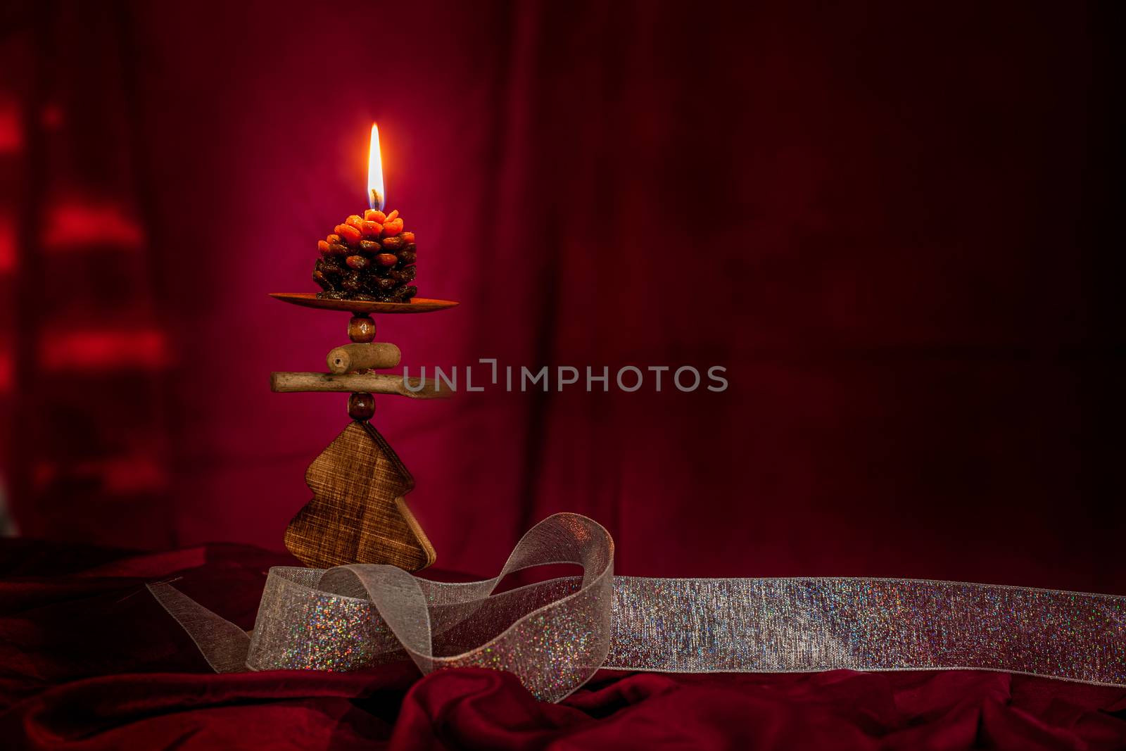 Christmas concept with red background and candles with copy space