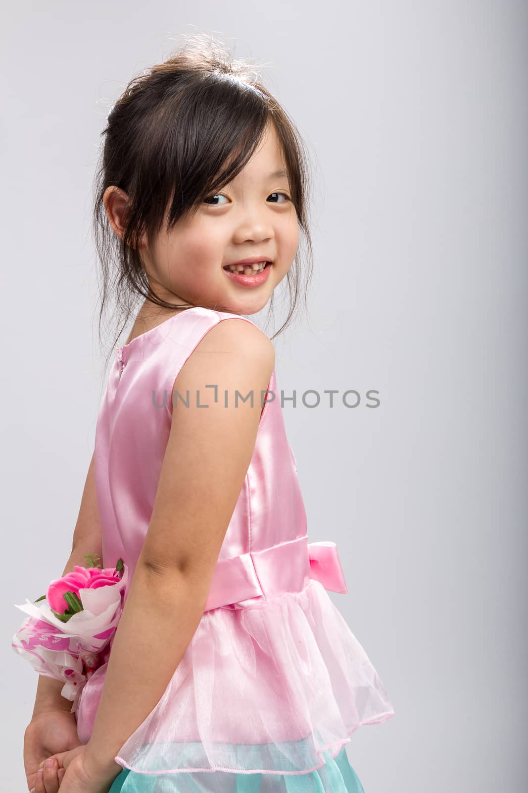 Young Girl Holding Flower, Rear View / Young Girl Holding Flower by supparsorn