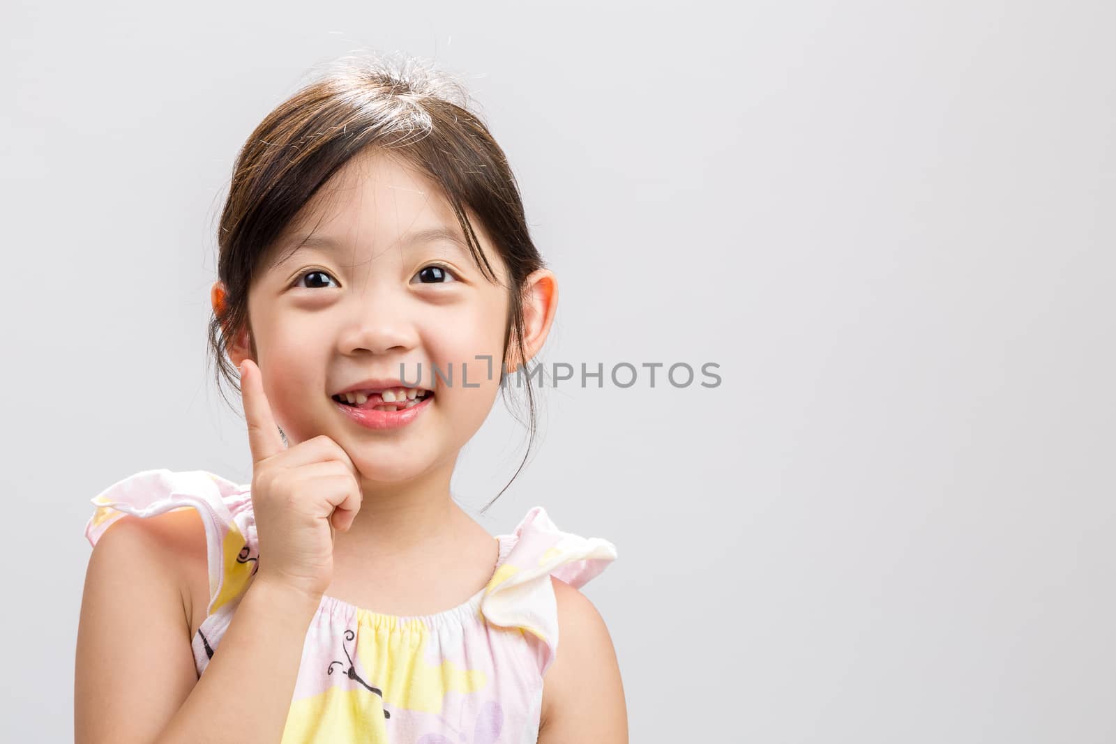 Cute Asian girl expressing smart concept, studio isolated white background.