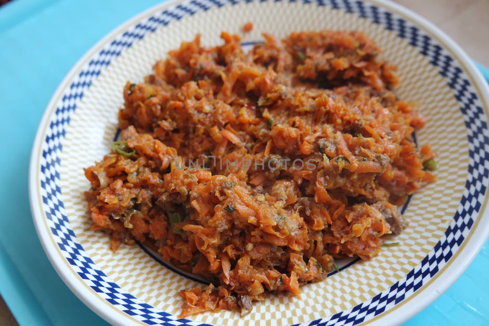 Top closeup view of a homemade dish made from carrot and vegetables. by Photochowk