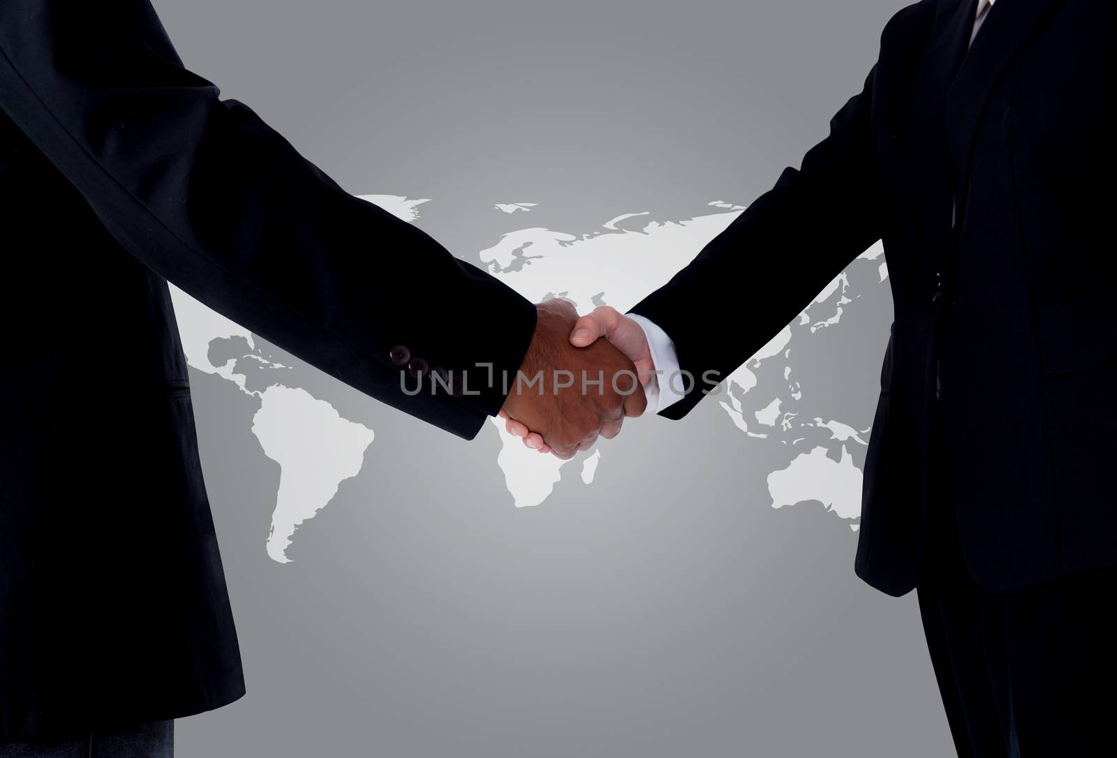 Business with people shaking hands with a global background