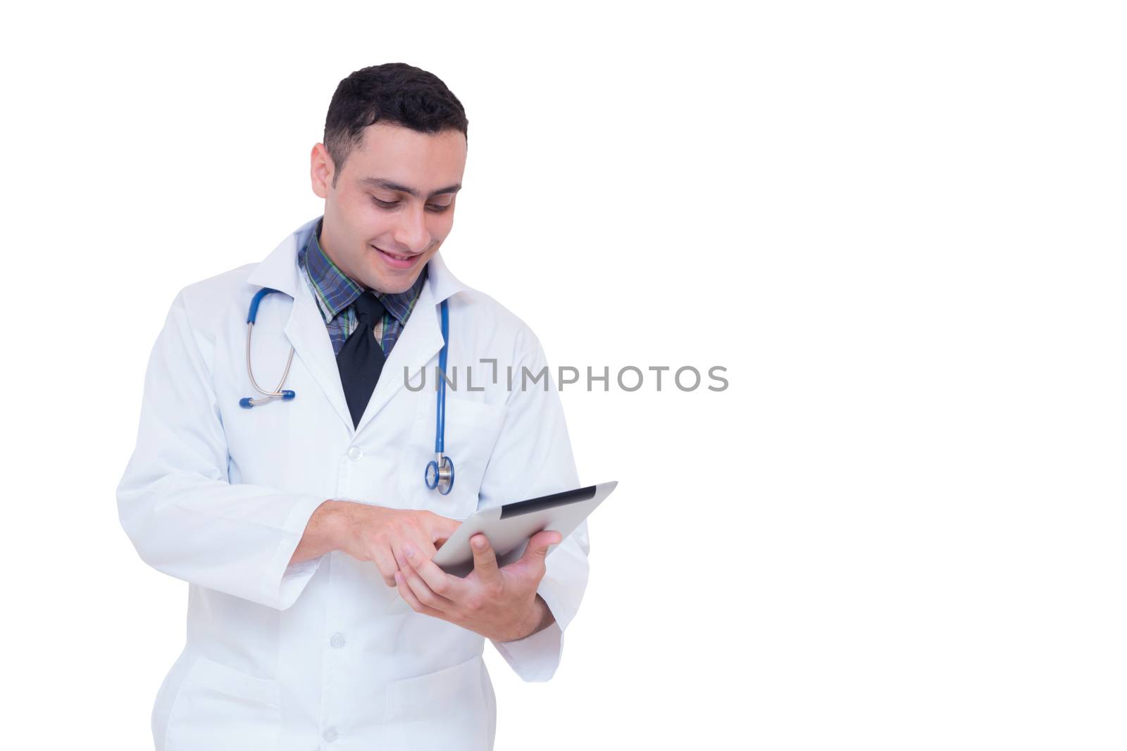 Doctor holding a tablet computer while using it isolated on white background