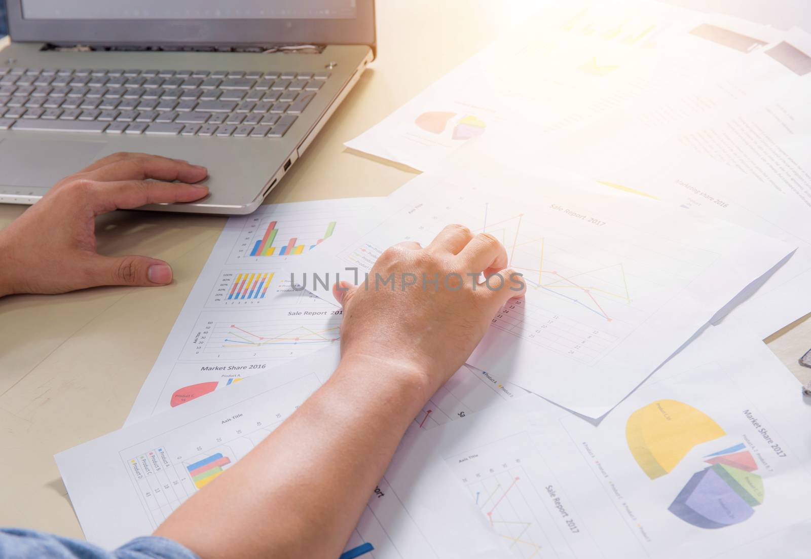 Financial paper charts, graphs and notebook on the table