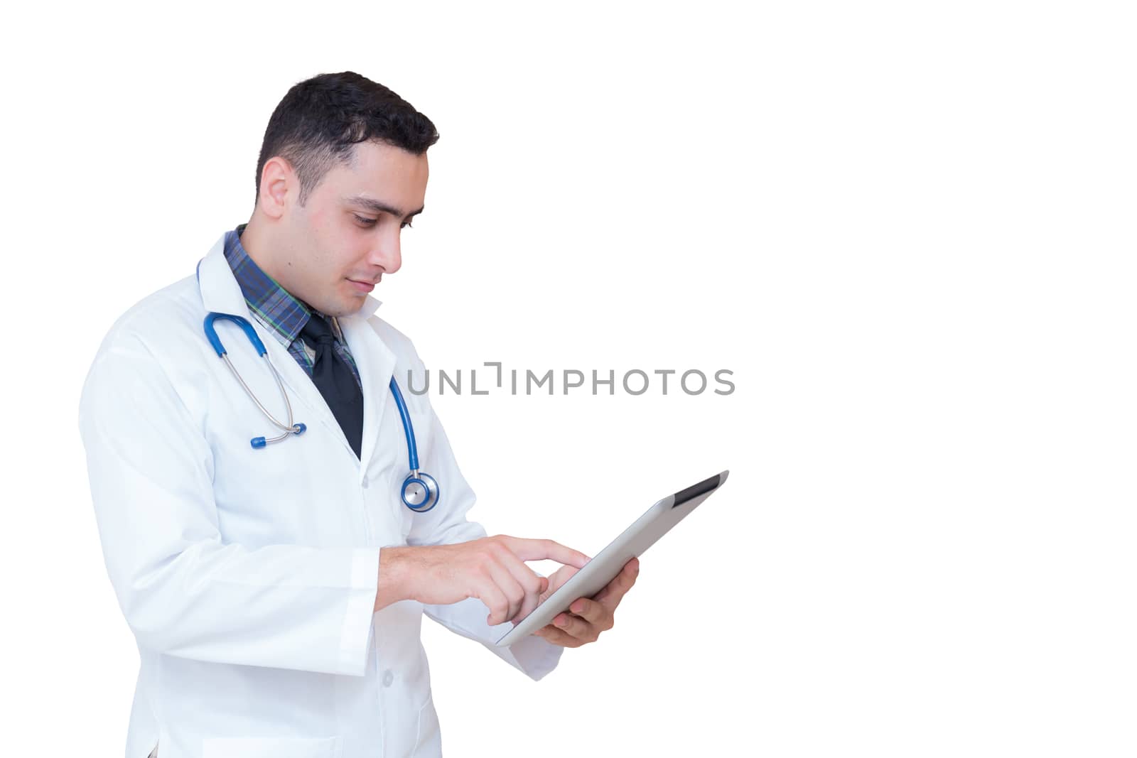 Doctor holding a tablet computer while using it isolated on whit by nnudoo