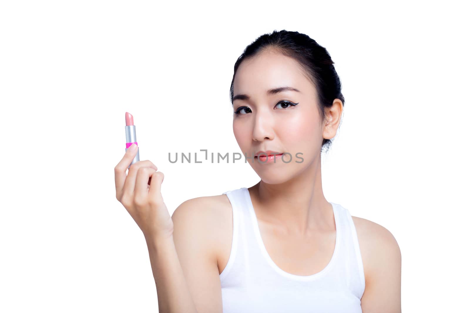 attractive young woman applying pink glossy lipstick isolated on by nnudoo