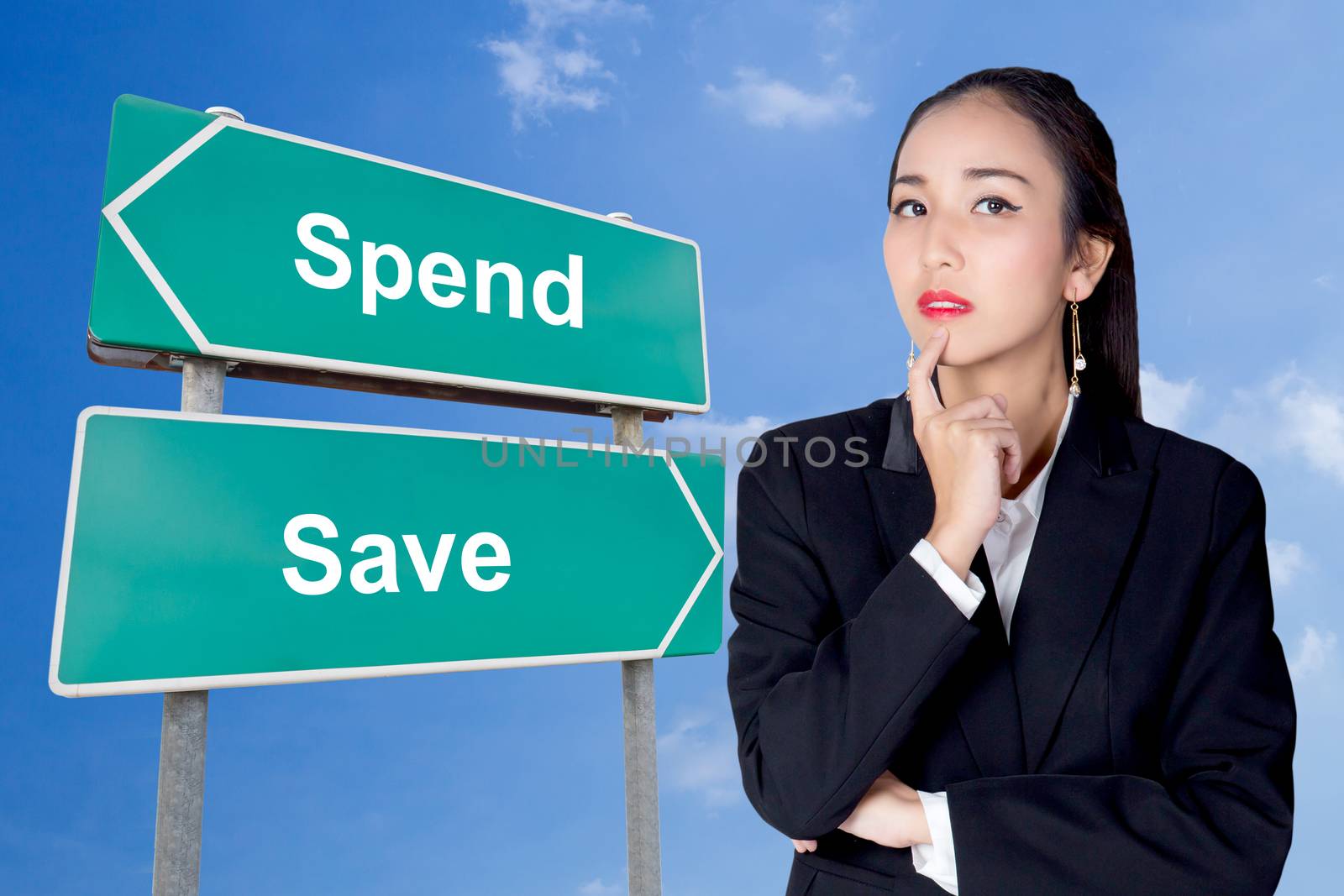 Spend save road sign with business woman thinking choice directi by nnudoo
