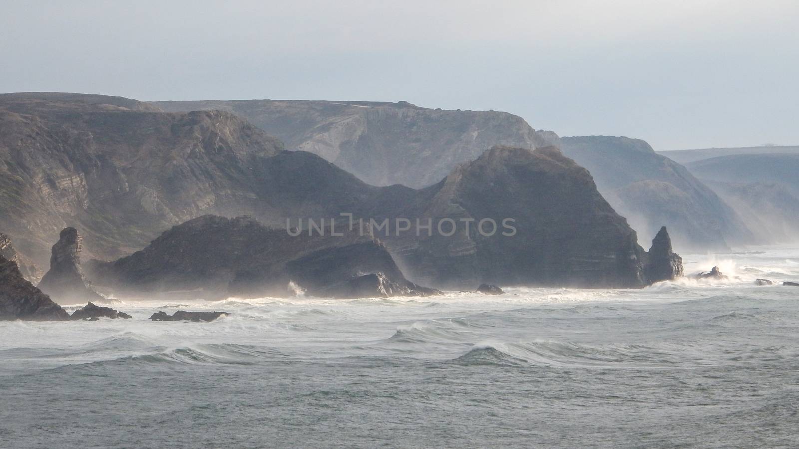 Panoramic view of the Algarve ocean cliffs, Portugal, the long coastline in the morning with a dramatic dreamlike atmosphere by robbyfontanesi