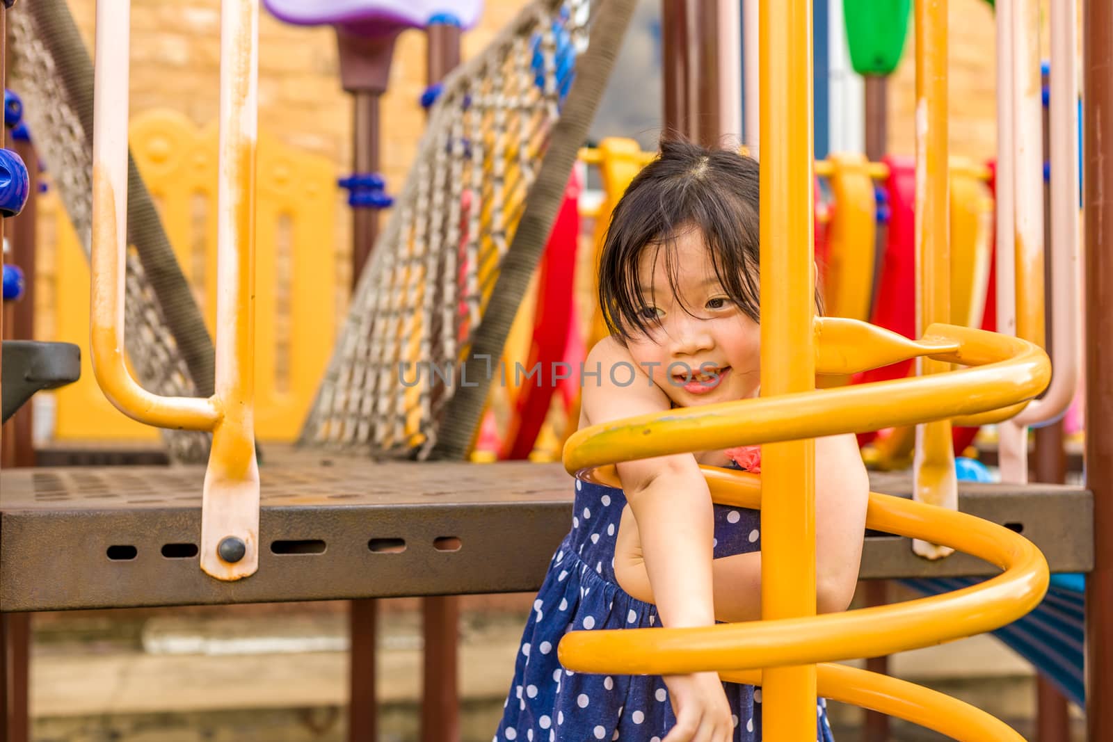 Child Playing on Playground / Happy Child Playing on Playground by supparsorn