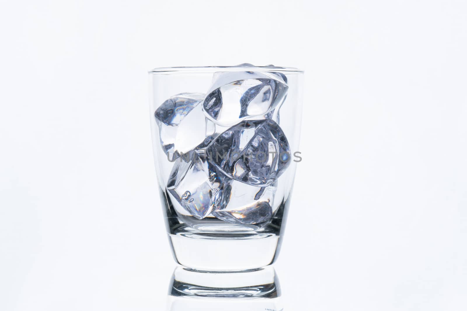 glass with ice cube isolated on white background 