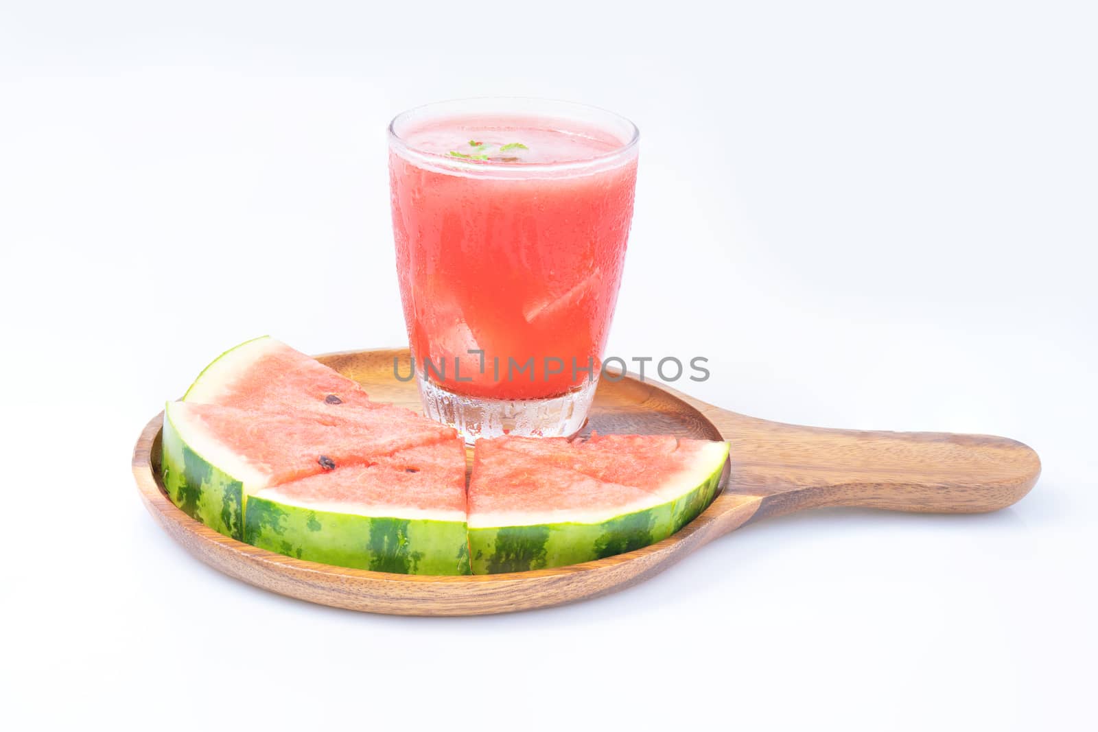 watermelon juice with slice piece on wood tray and isolated on white background