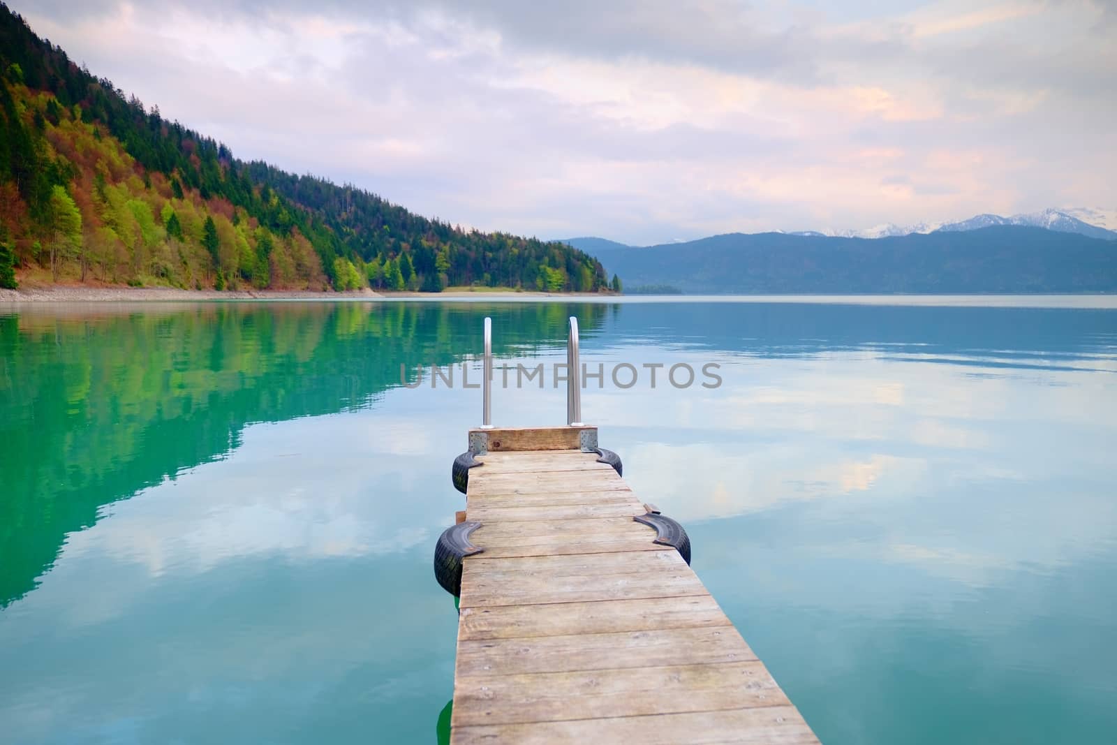 Empty wooden mole on blue Alps lake, wharf for hired boats in marina by rdonar2