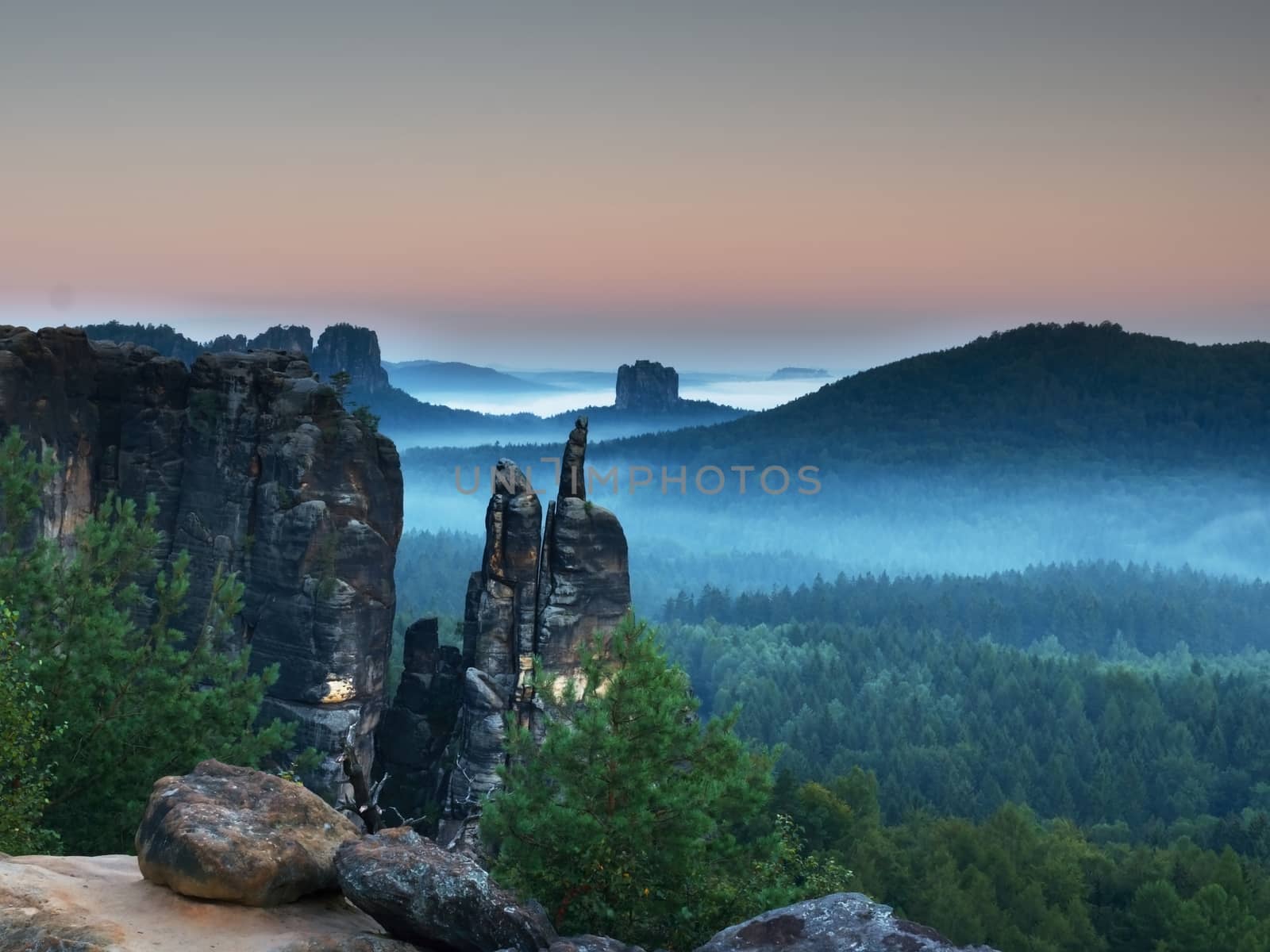 Autumn evening panorama view over sandstone rocks to fall valley of Saxony Switzerland.  by rdonar2