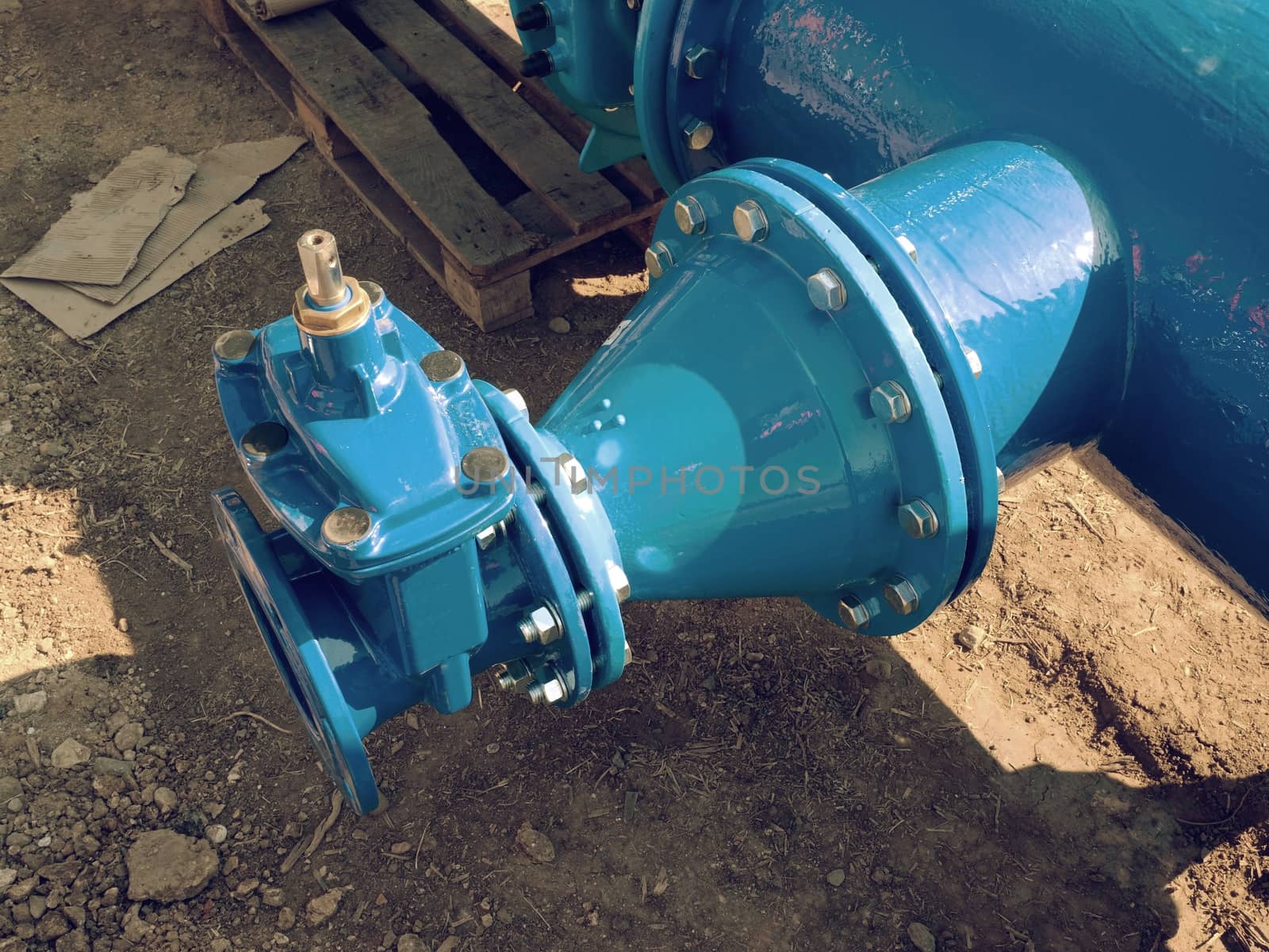 Dring water piping , Gate valves and reduction member. Pipe fittings joint with new screws and nuts. Repairing process to connect drink water supply.
