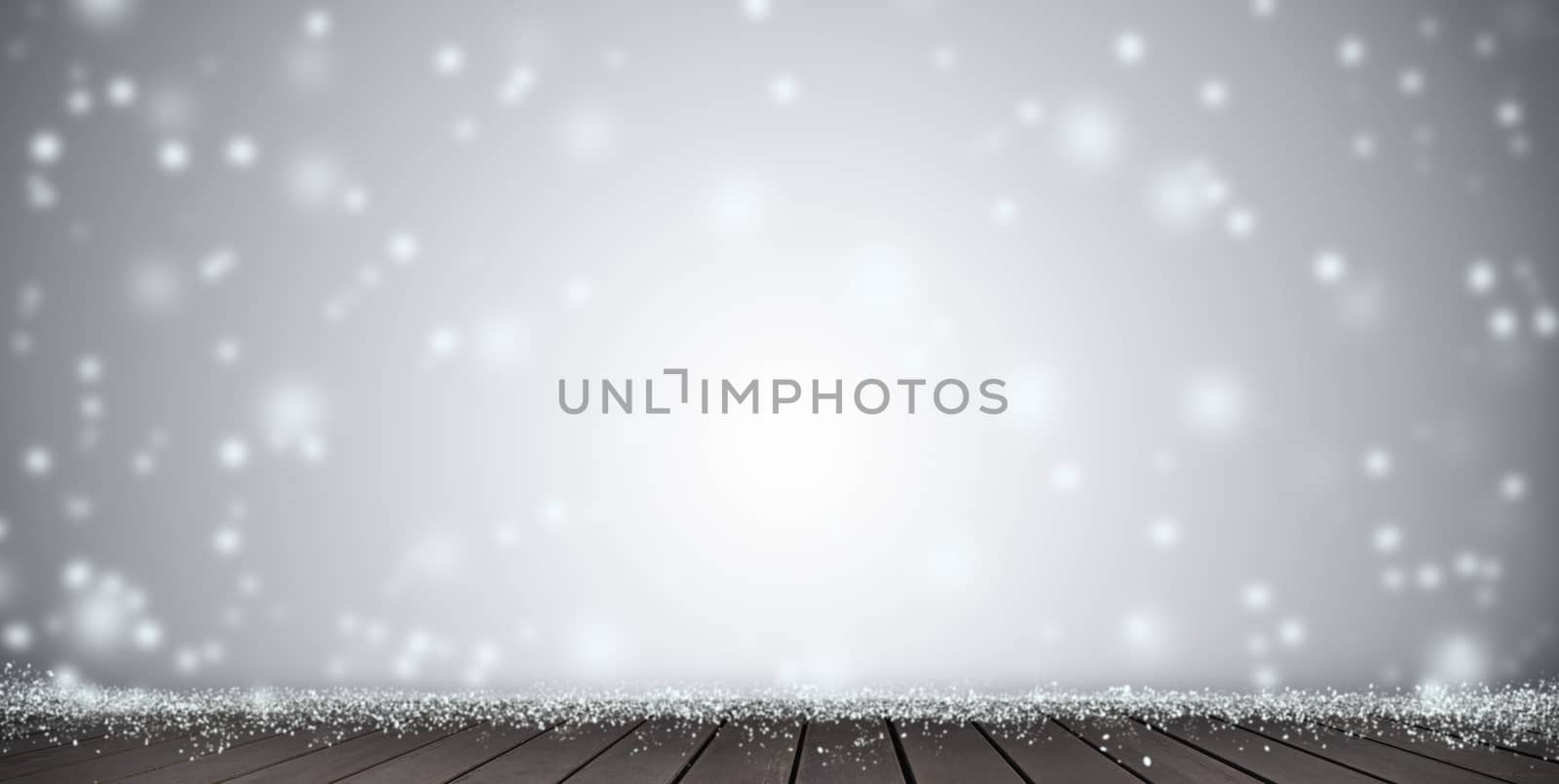 Wood table top on blur Christmas tree and white bokeh in snowfall background