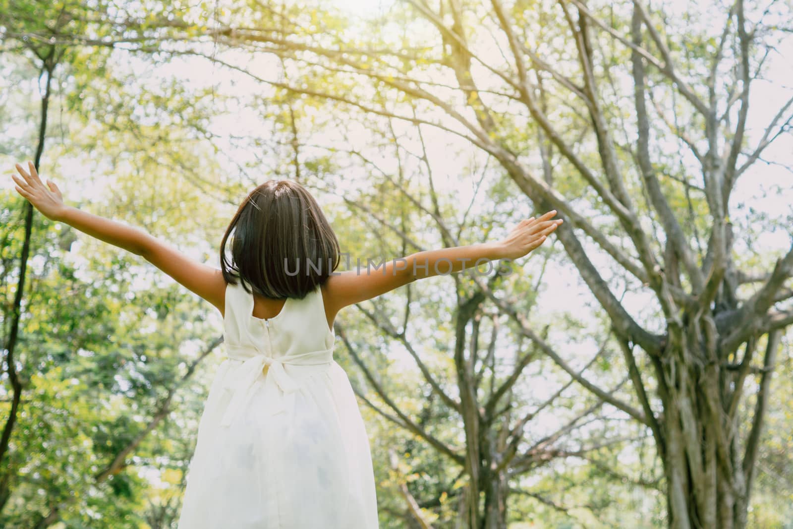 Young girl freedom and happy free in park by ngad