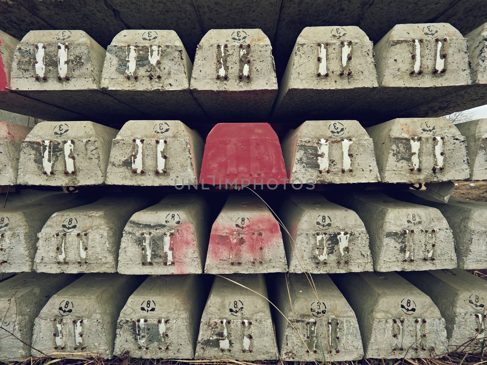 Sleepers stock in railway depot. New concrete railway ties stored for reconstruction of old railway station. by rdonar2