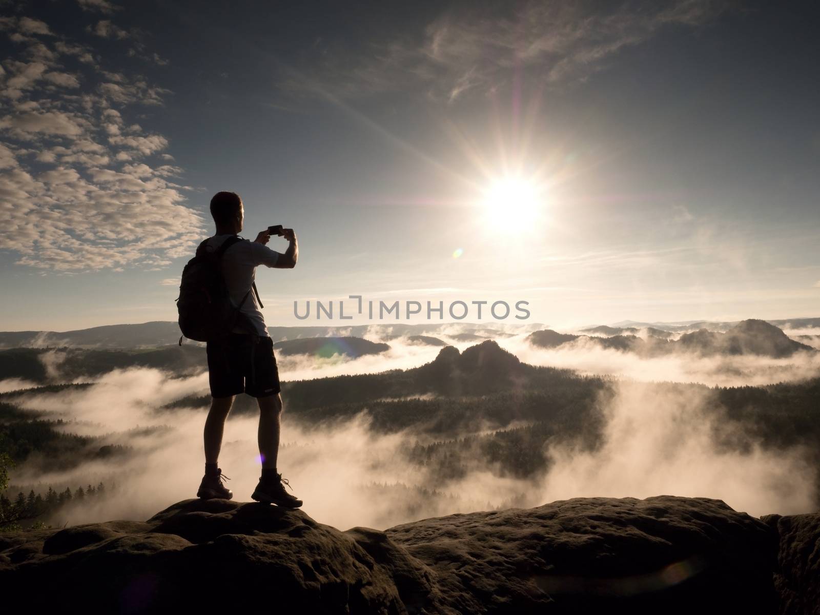 Man at the top of a mountain looking the misty landscape. Feel free by rdonar2