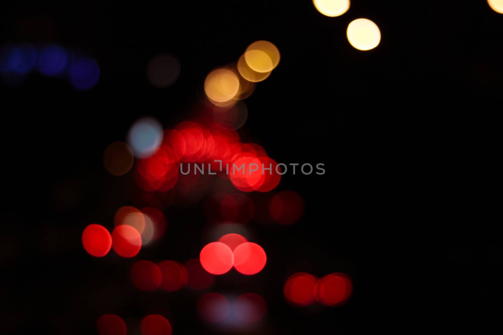 Defocused city night soft blur bokeh background of car light in retro and vintage style