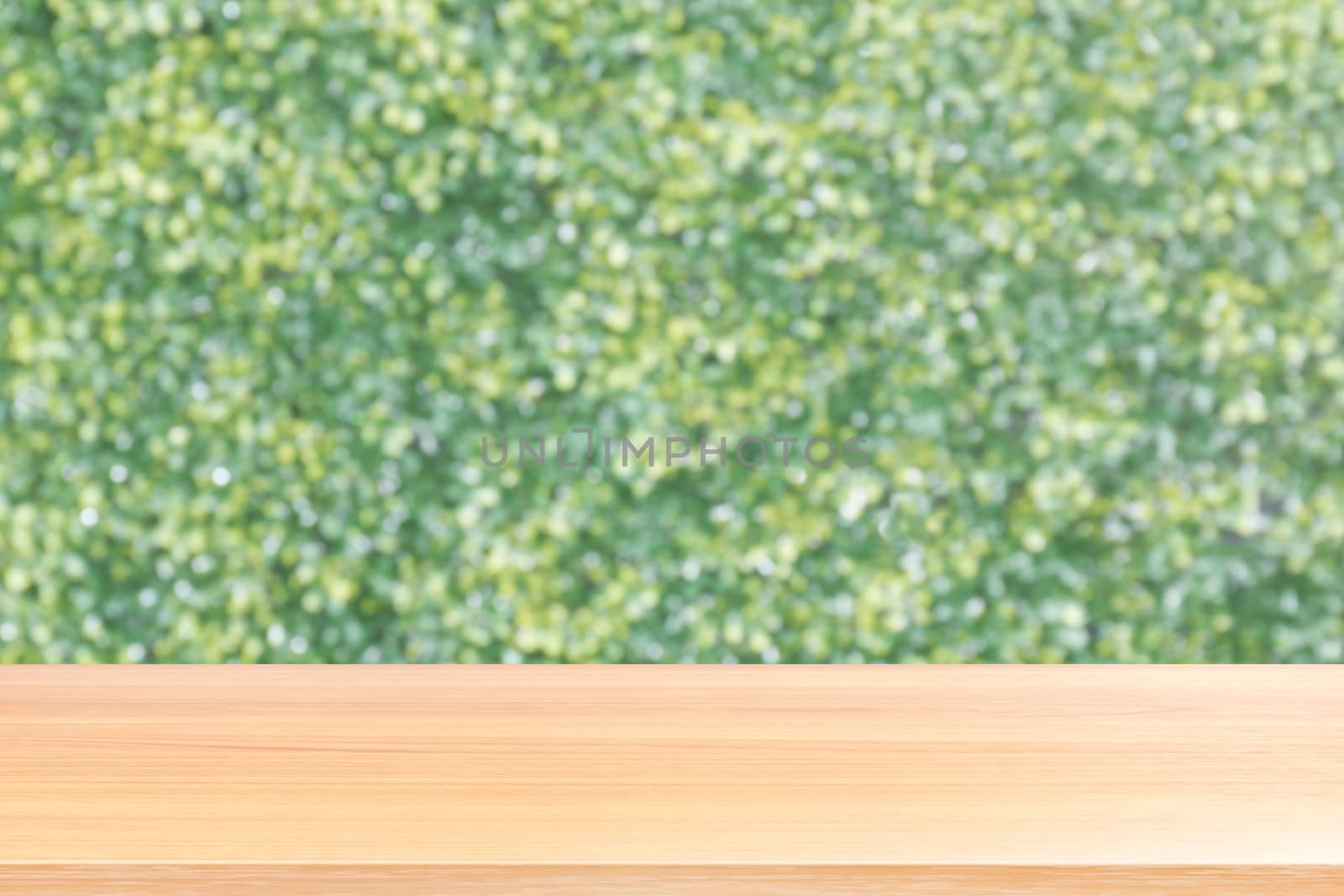 wood table board empty in front, wooden plank blank on bokeh nature green background, perspective brown wood table front for mock up display products