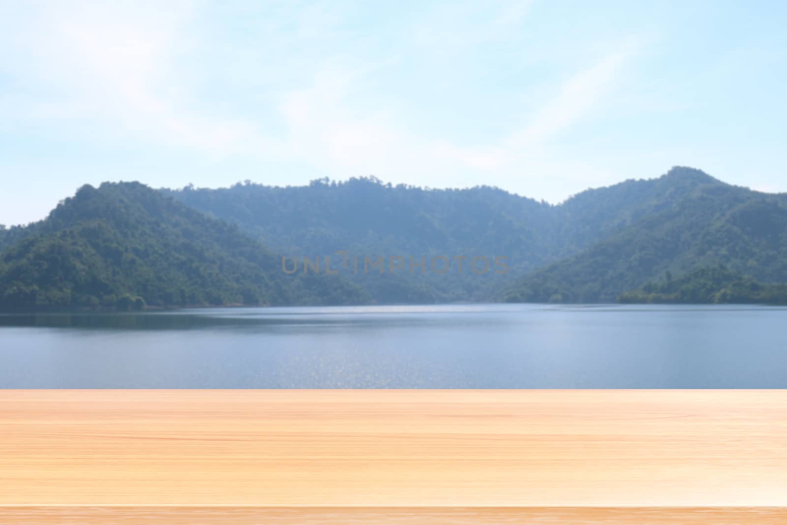 empty wood table floors on blurred river and mountain landscape background, wood table board empty front lagoon nature, wooden plank blank on lagune and sky for mock up display products