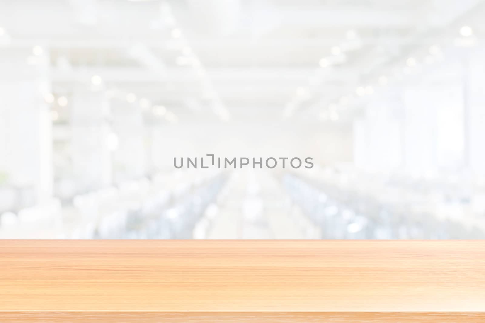 empty wood table floors on blurred white canteen dining hall room background, wood table board empty front eating food in university canteen blur background, wooden plank blank on cafeteria white soft by cgdeaw