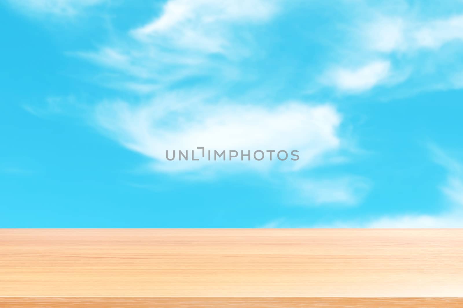 empty wood table floors on blurred blue sky and cloud background, wood table board empty front blur sky blue, wooden plank blank on sky with perspective brown wood table for mock up display products by cgdeaw