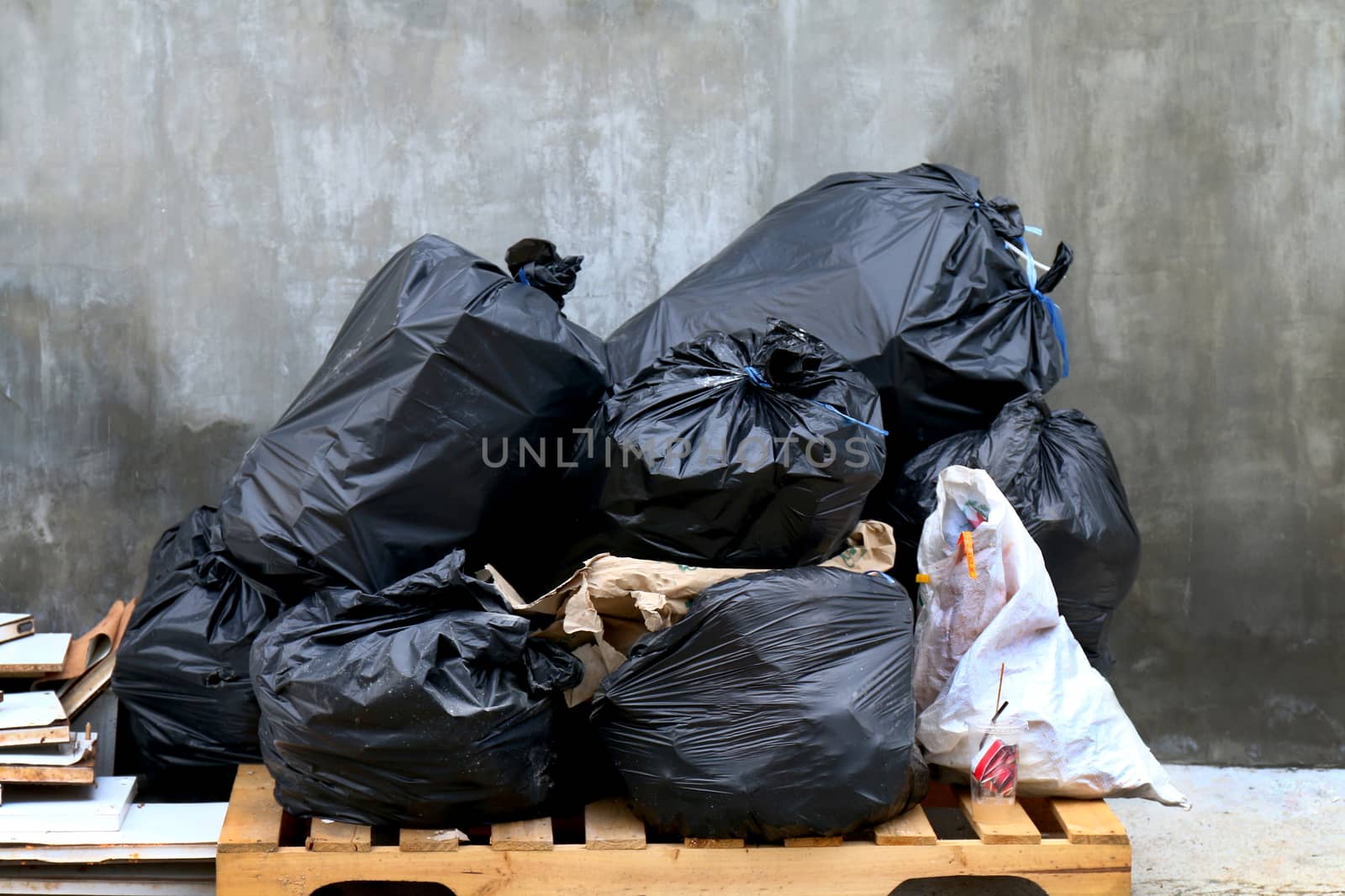 pile of waste garbage plastic black and trash bag stack waste many