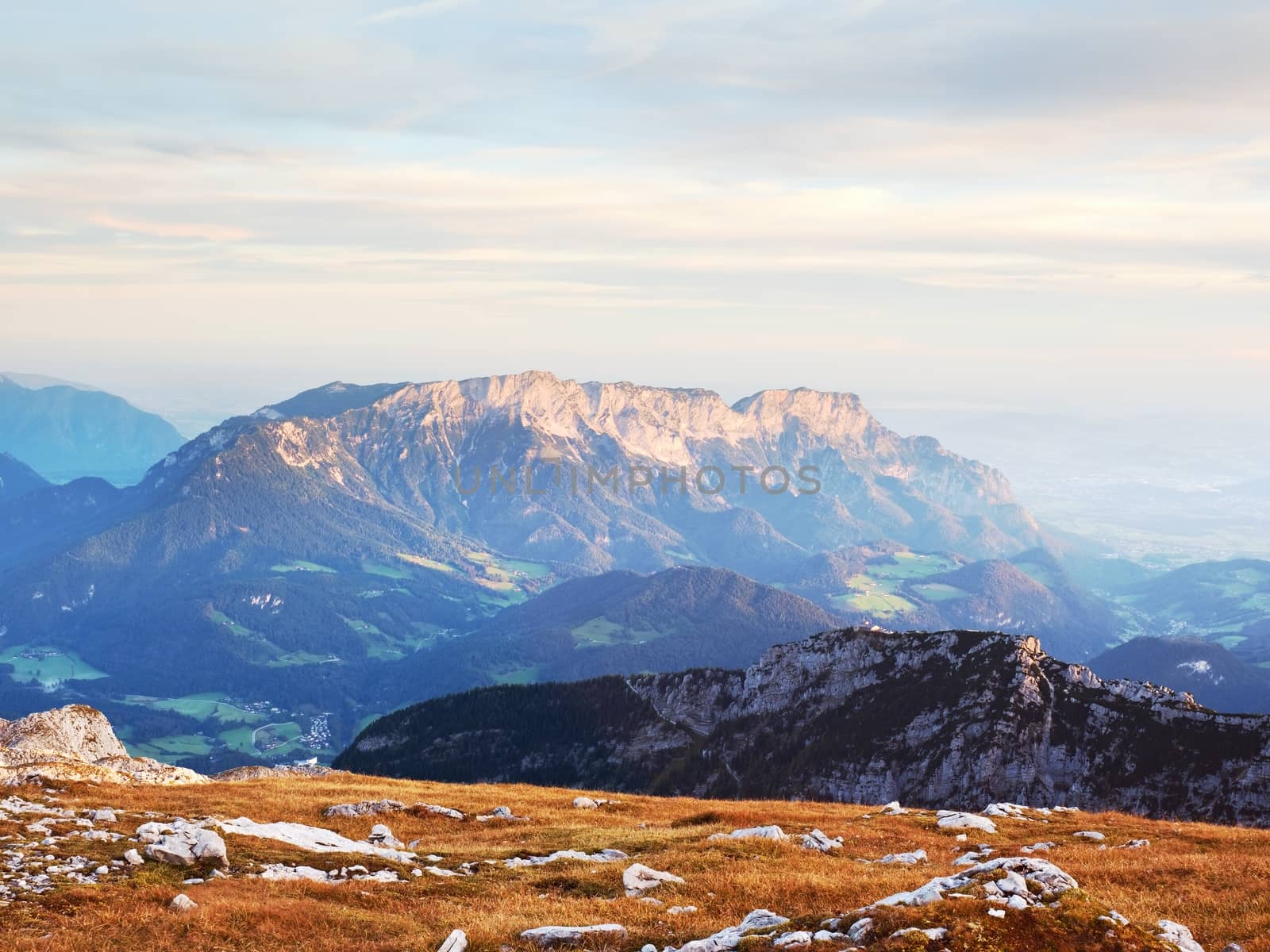 View from the top of the Alpine mountain of the mountains around. Spring in the mountains. Location Austria Alps, Europe. Beauty world.