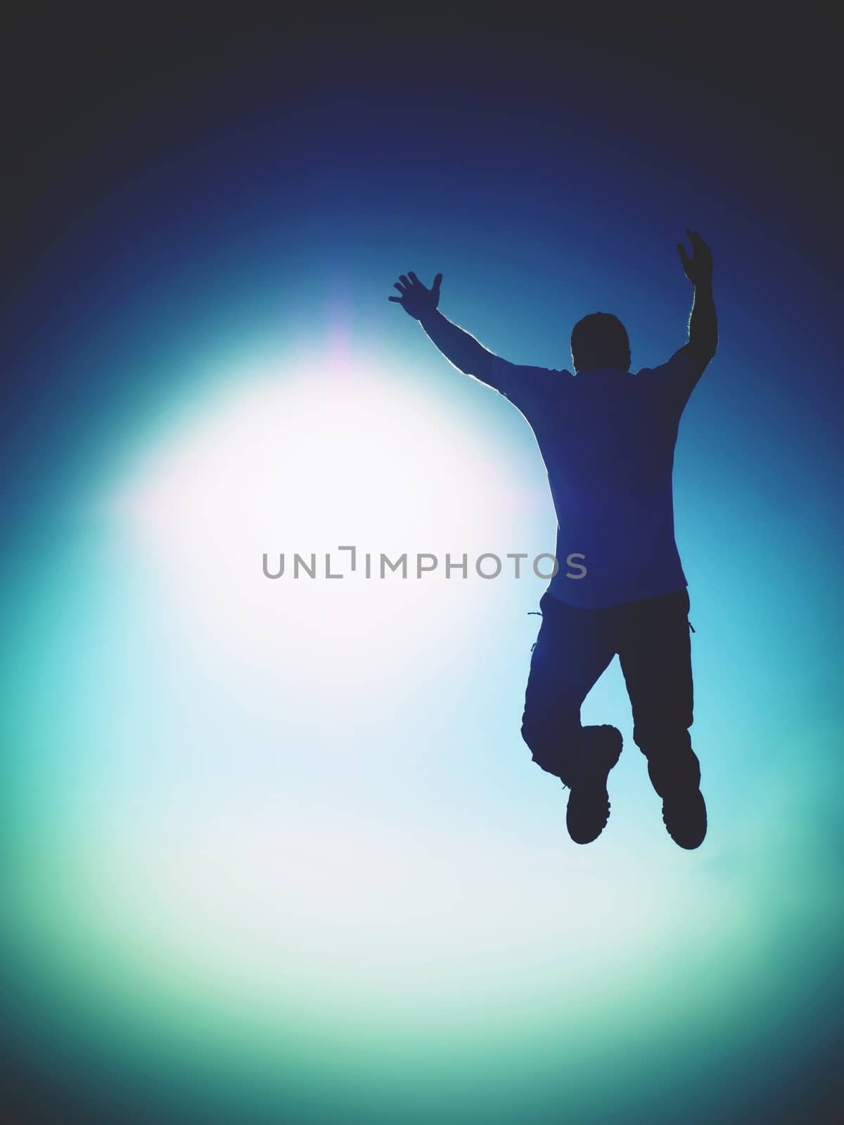 Man fly in air. Blue  Toned effect. Man falling down with hands up.  by rdonar2