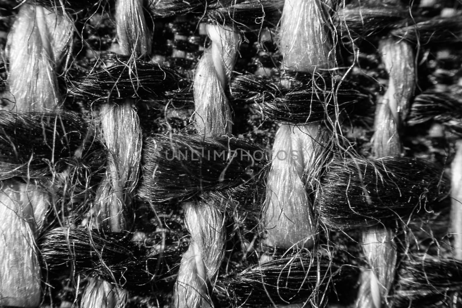 Texture of cloth material for design. Abstract background with white, black and gray threads of woven.