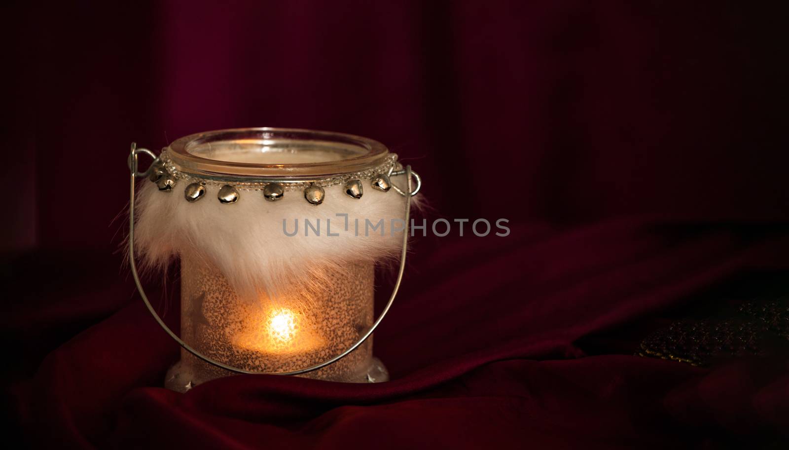 Red Christmas background with candle