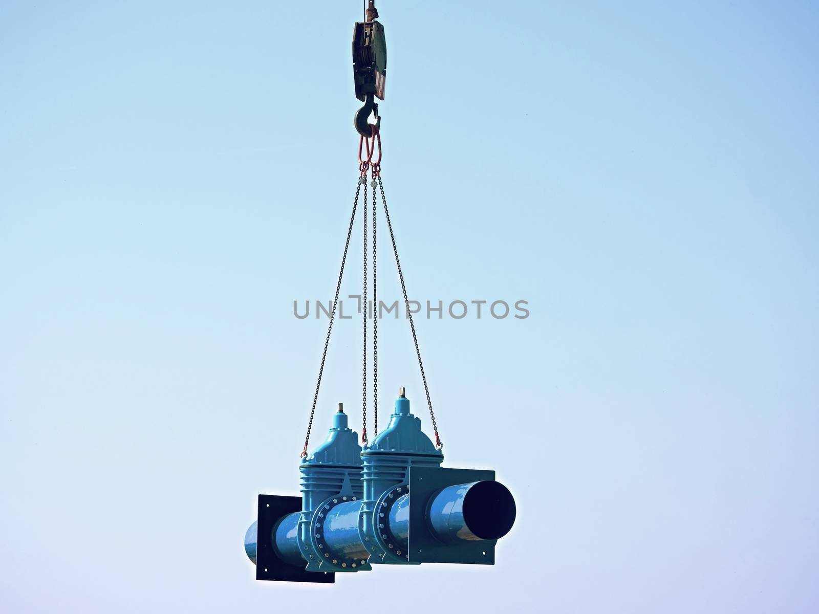 Crane is moving with new gate valve and 500 mm pipeline. Repairing of drink water pipeline system