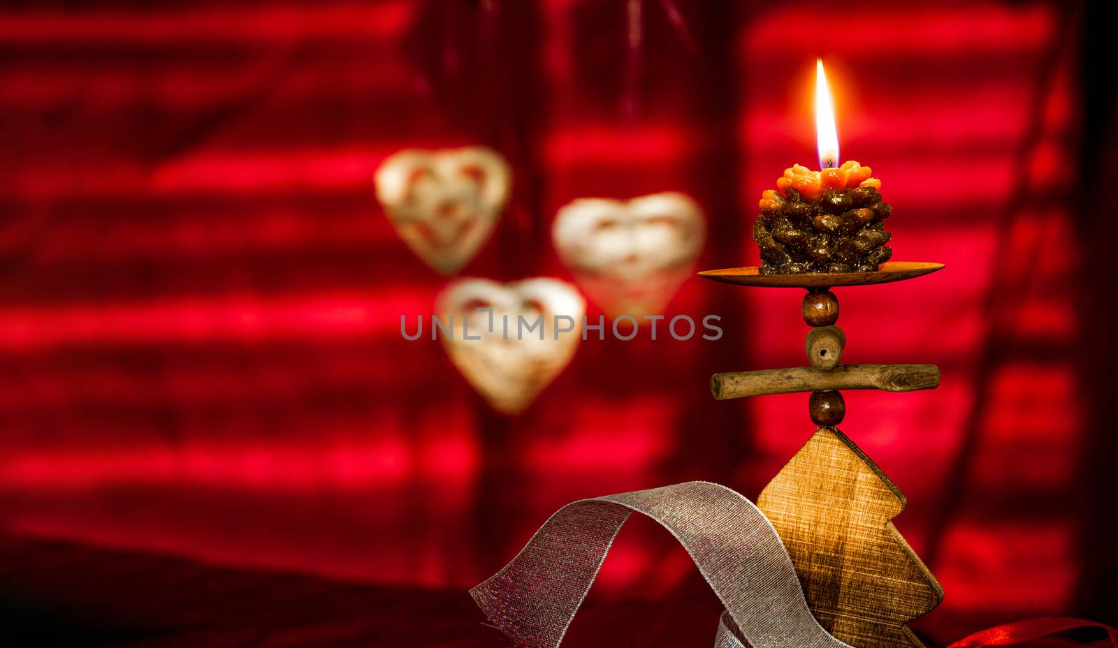 Red Christmas background with candle