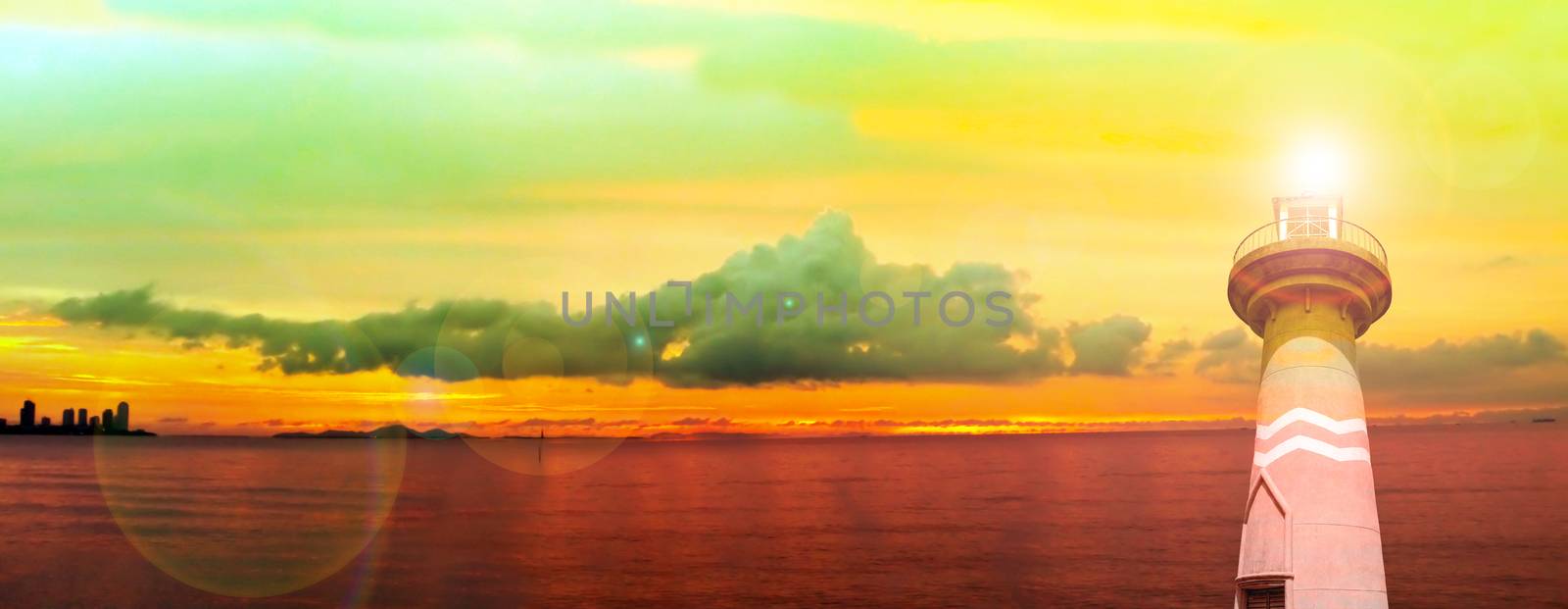 lighthouse ebb tide sunset on horizon in sea panorama