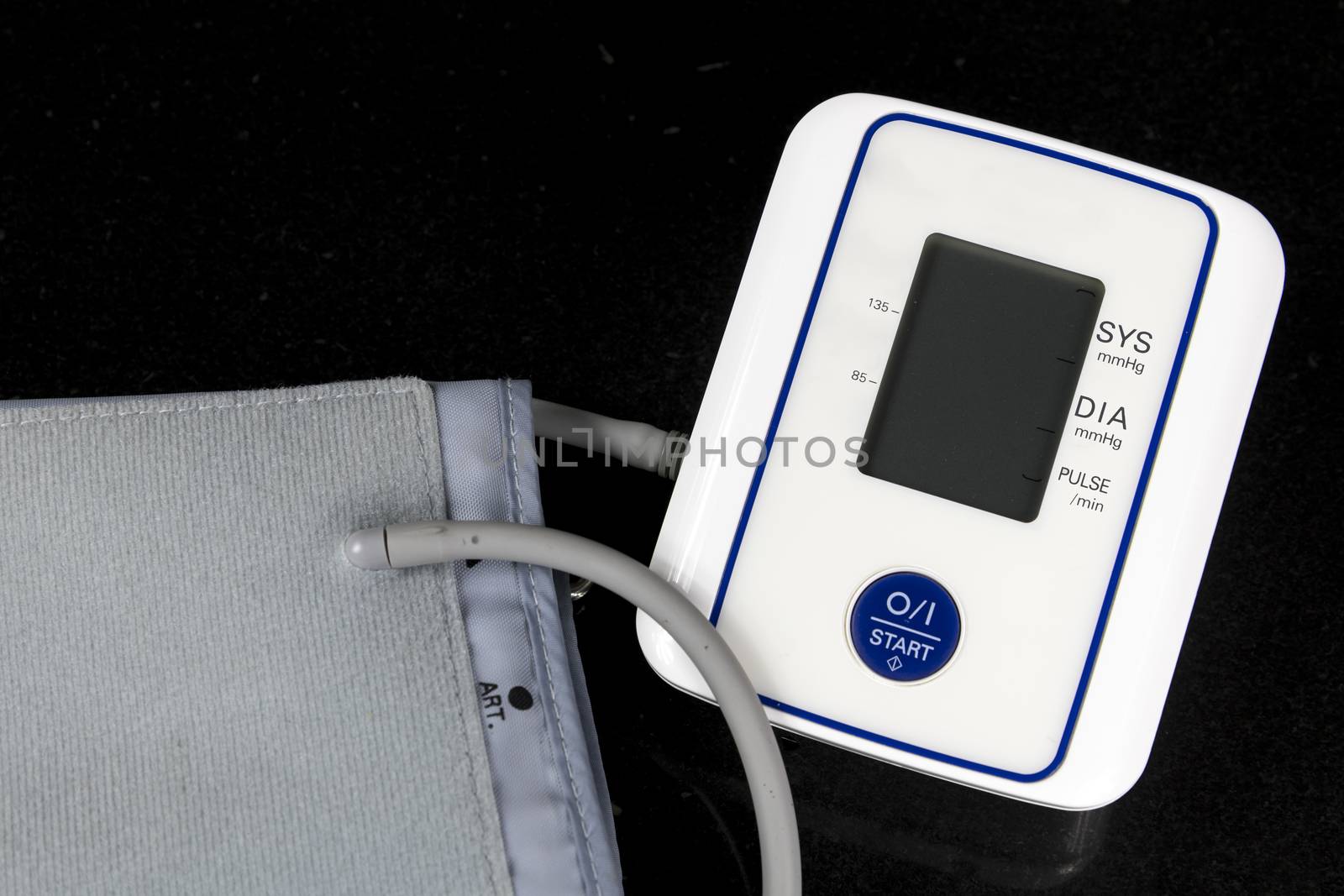 Automatic Blood Pressure Monitor with grey screen on black background