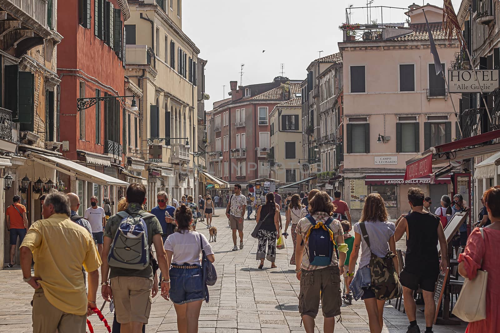 VENICE, ITALY 2 JULY 2020: Tourists walk in Venice street