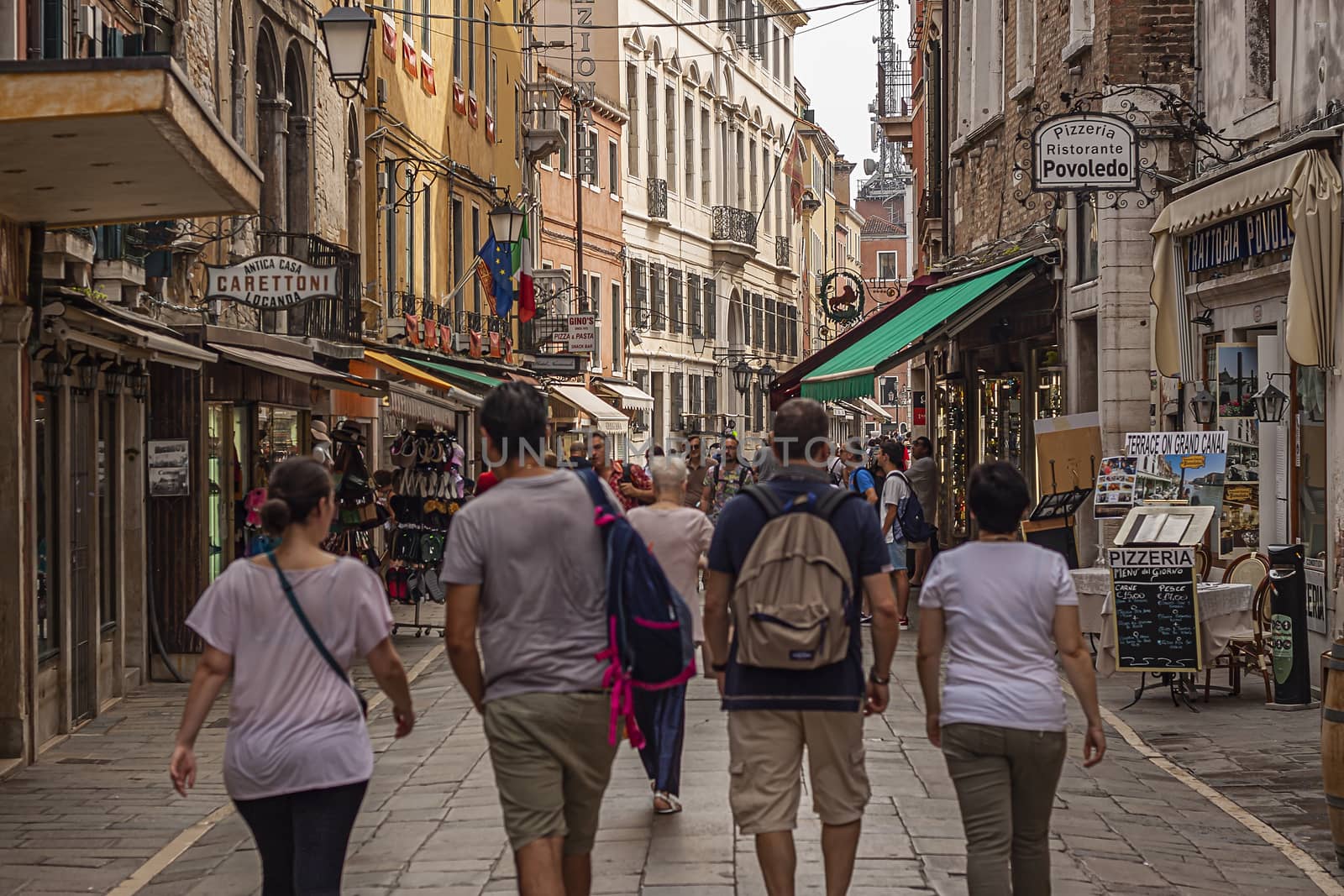 VENICE, ITALY 2 JULY 2020: Tourists walk in Venice street