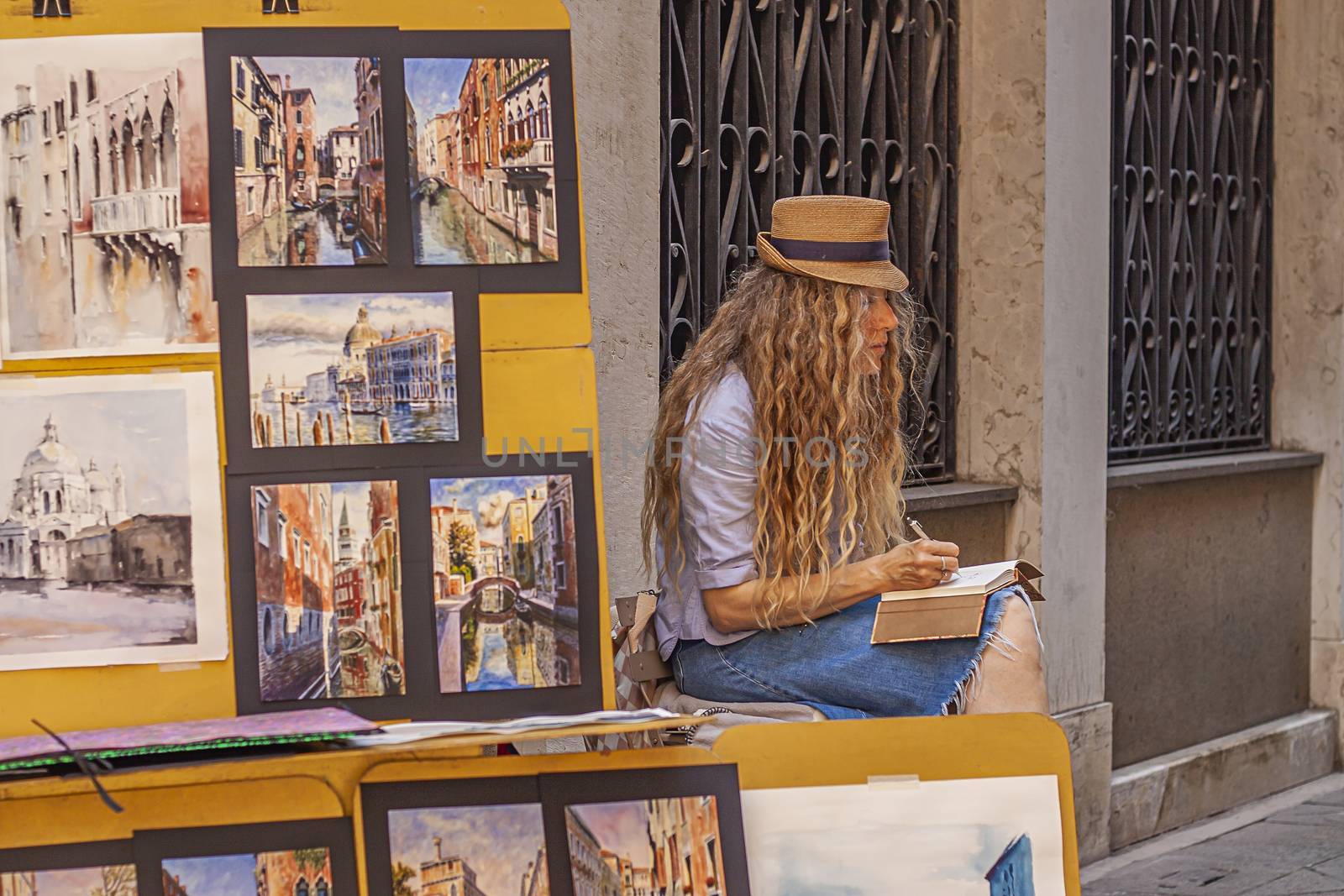 VENICE, ITALY 2 JULY 2020: Street artist painter in Venice