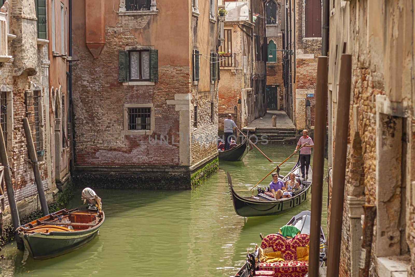 VENICE, ITALY 2 JULY 2020: Gondolier in Venice canal